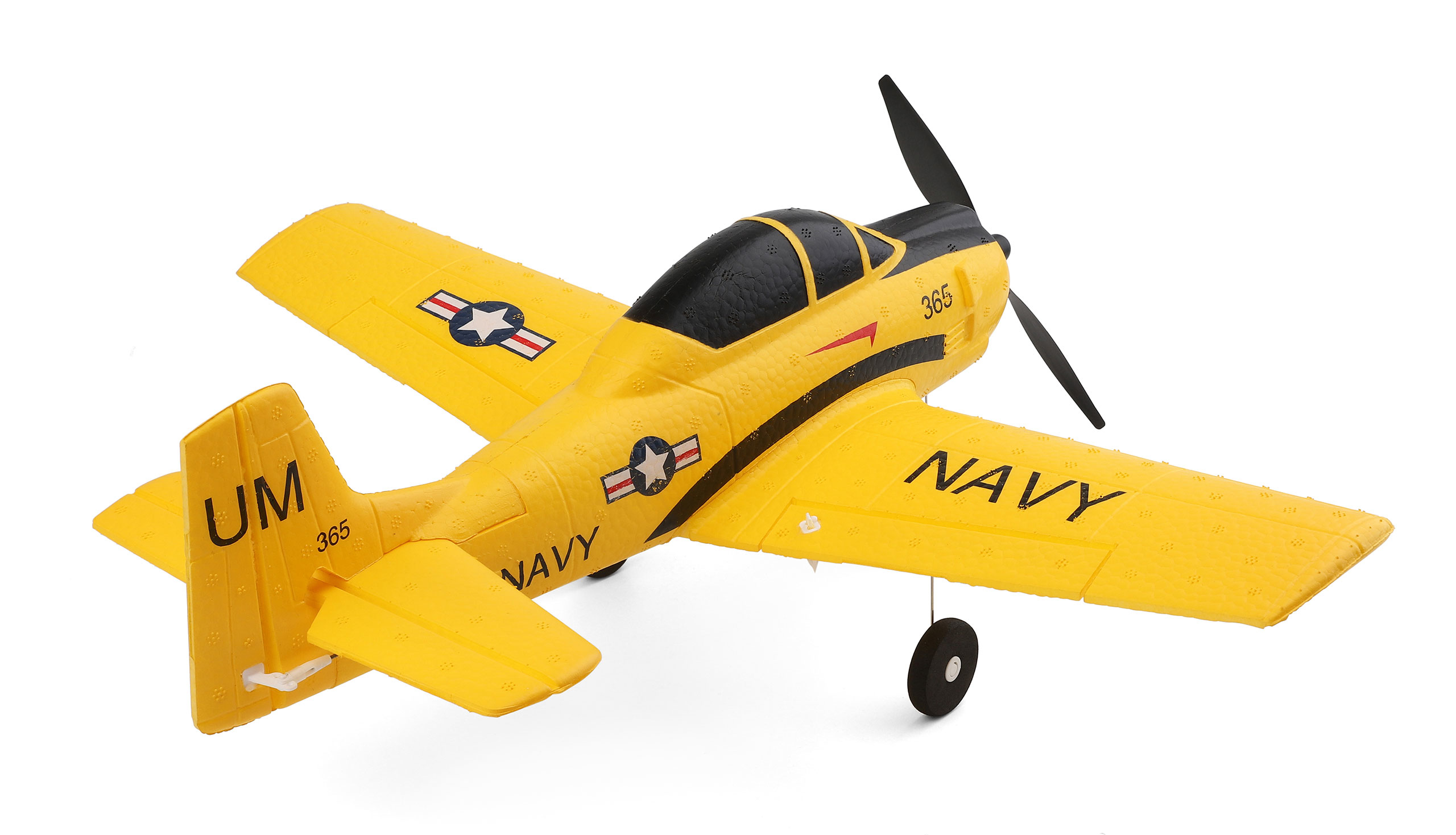 Un avión de juguete amarillo con acentos negros, etiquetado "NAVY" y "UM".