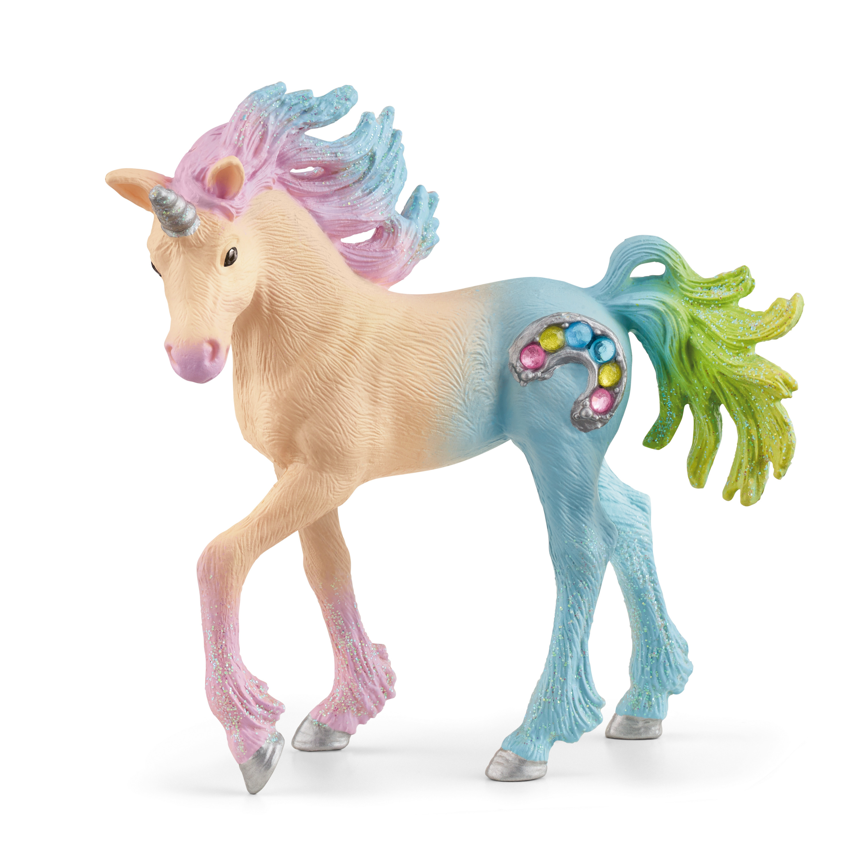 Una figura di unicorno giocattolo con corpo pastello, gioielli colorati e criniera glitterata.