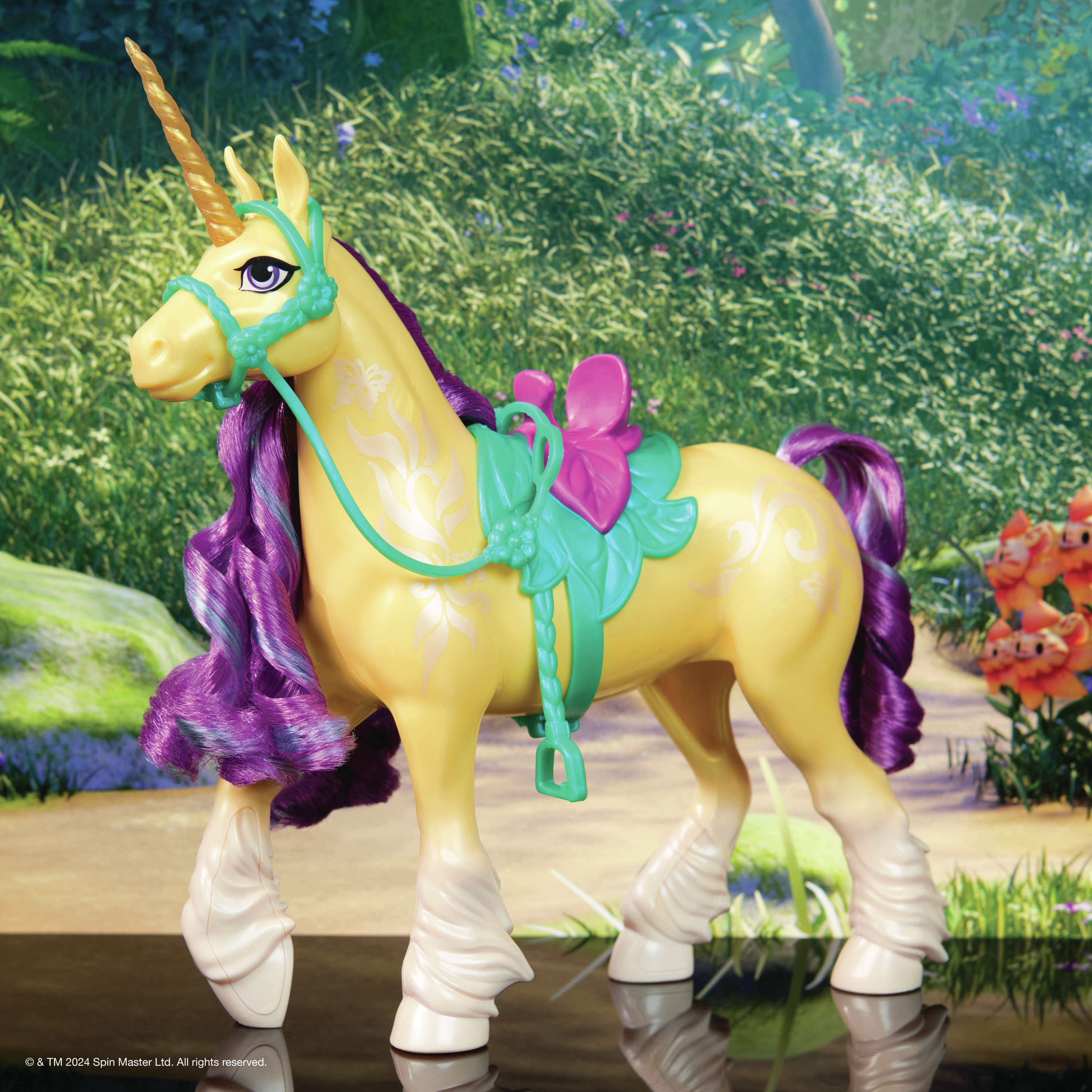 A yellow toy unicorn with purple mane and teal harness, standing in a garden.