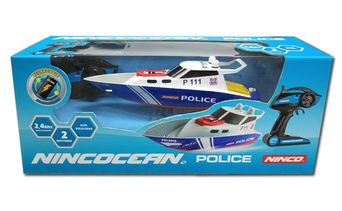 Barcos de policía azules y blancos con control remoto en embalaje.
