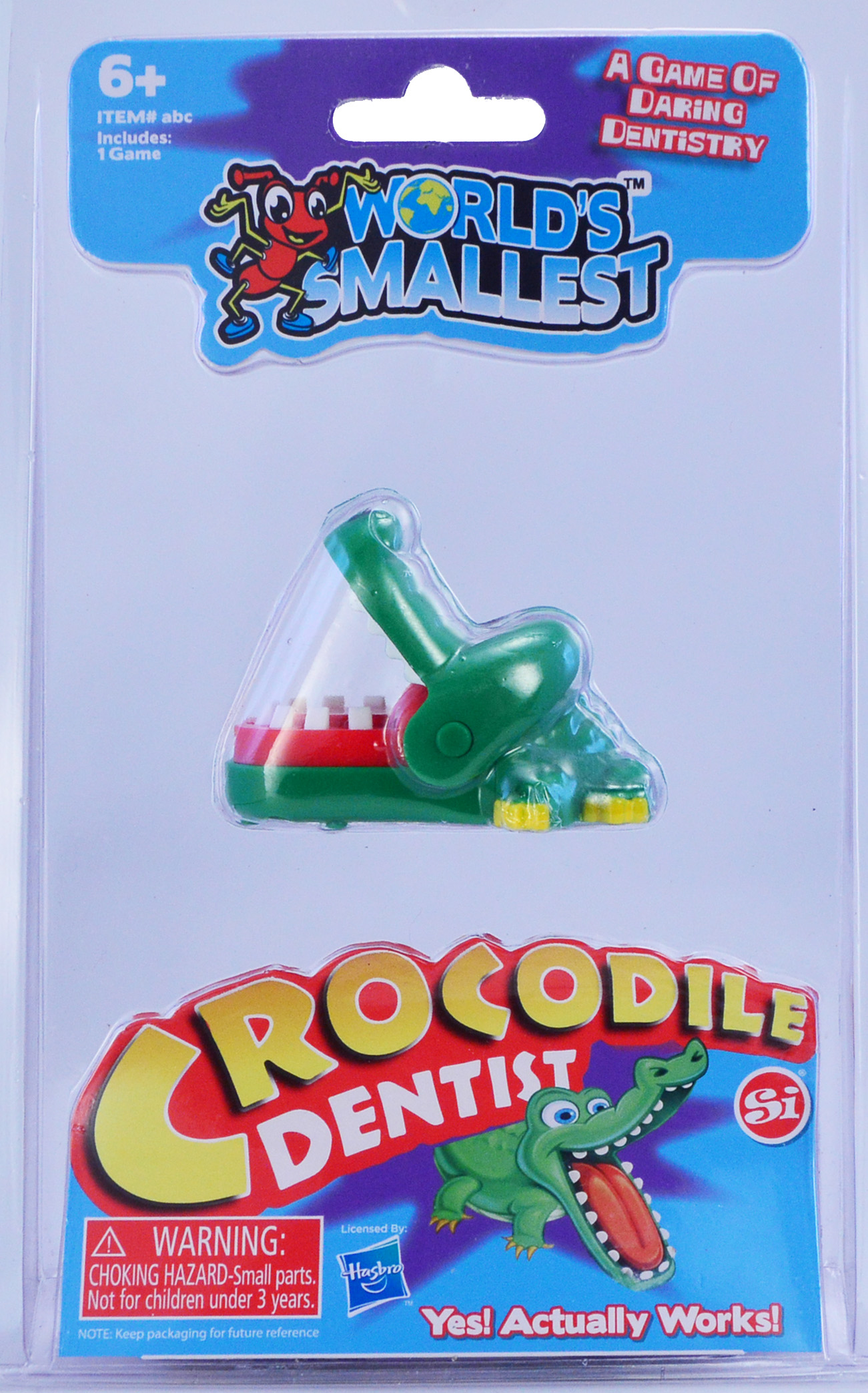 Confezione del gioco 'World's Smallest Crocodile Dentist' con un coccodrillo verde.