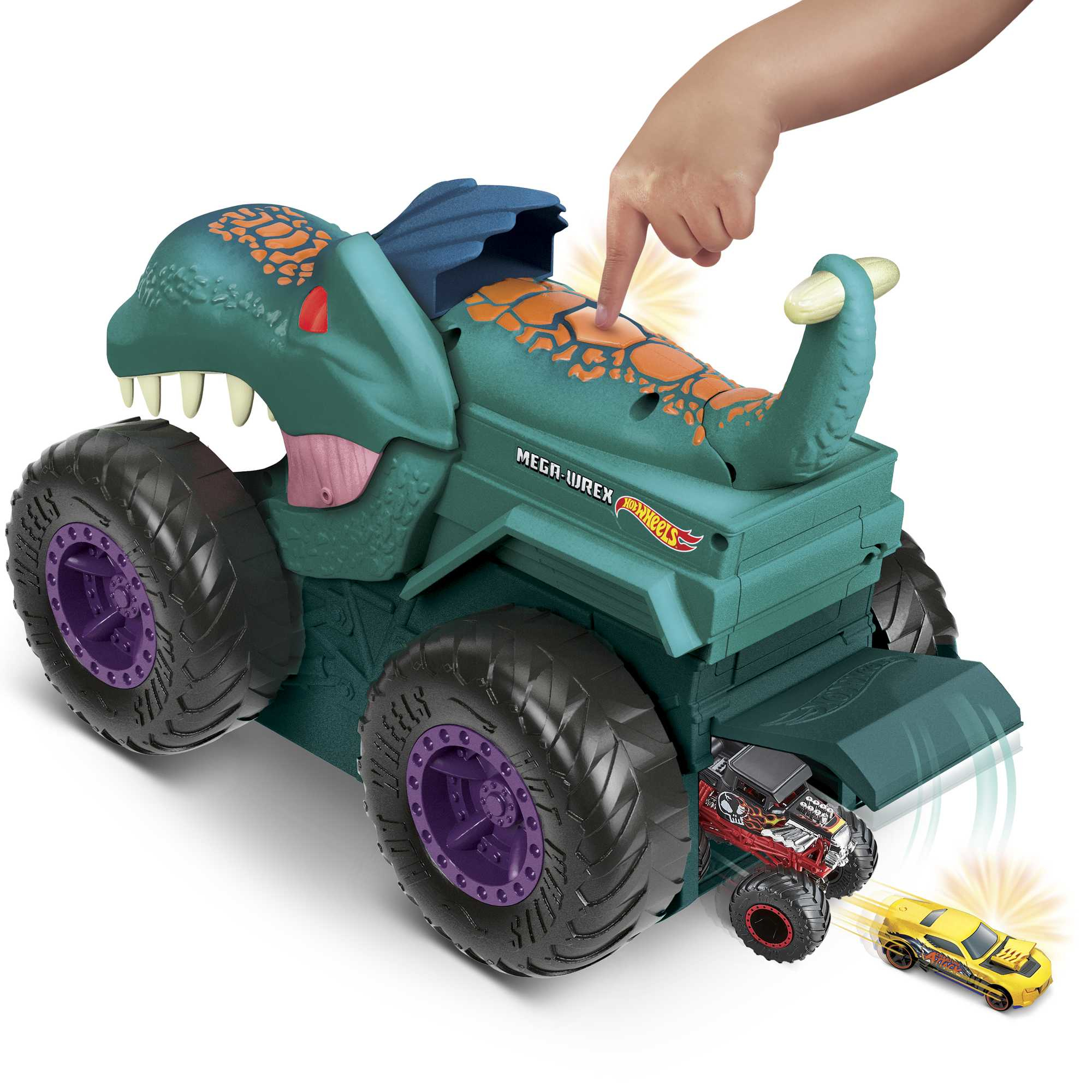 Grünes Dino-Spielzeugauto mit großen Rädern, ein Kind drückt einen Knopf, Autos fahren heraus.