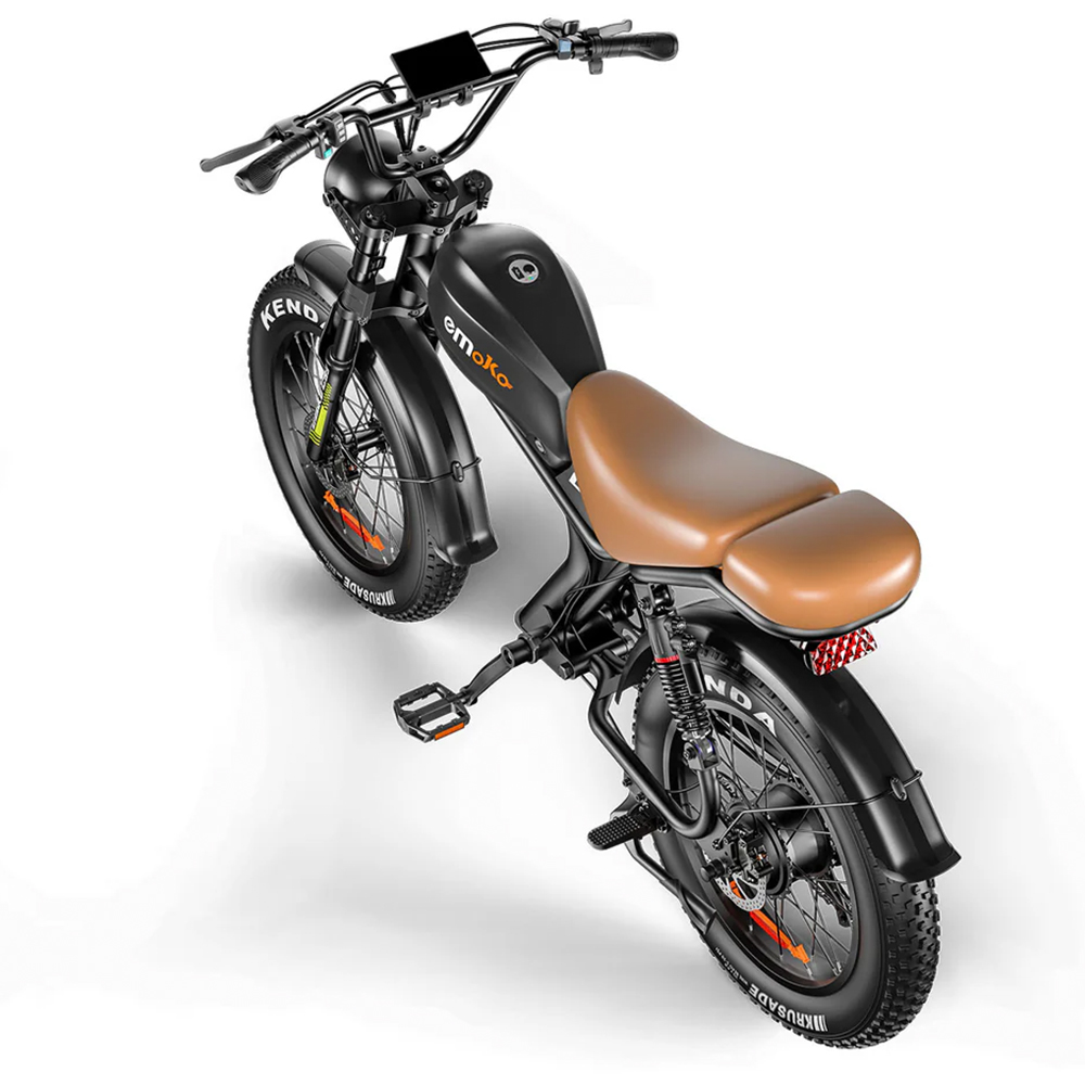 Bicicleta eléctrica negra con asiento marrón y neumáticos anchos.