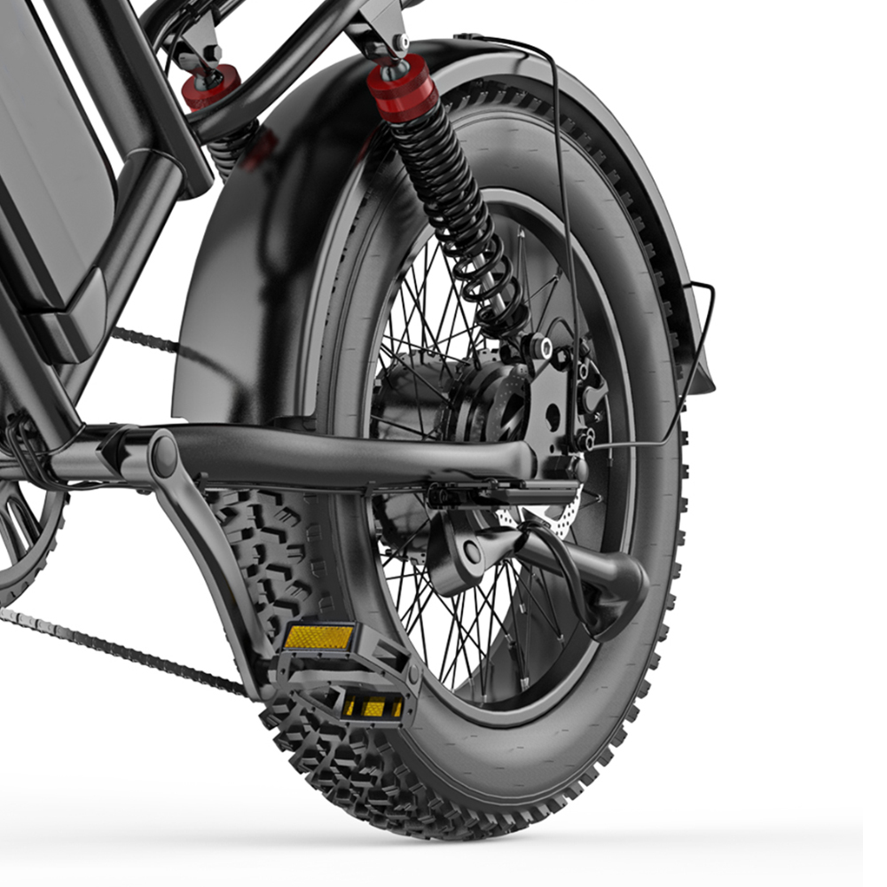 Primer plano de la rueda trasera de una e-bike negra, con suspensión y pedales.