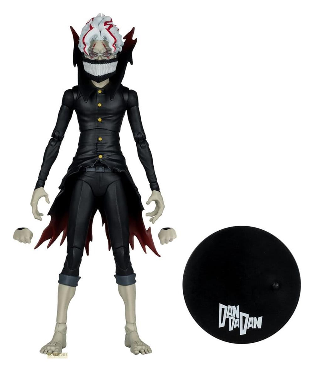 Eine Actionfigur mit weißem Haar, schwarzem Anzug und grinsender Maske.