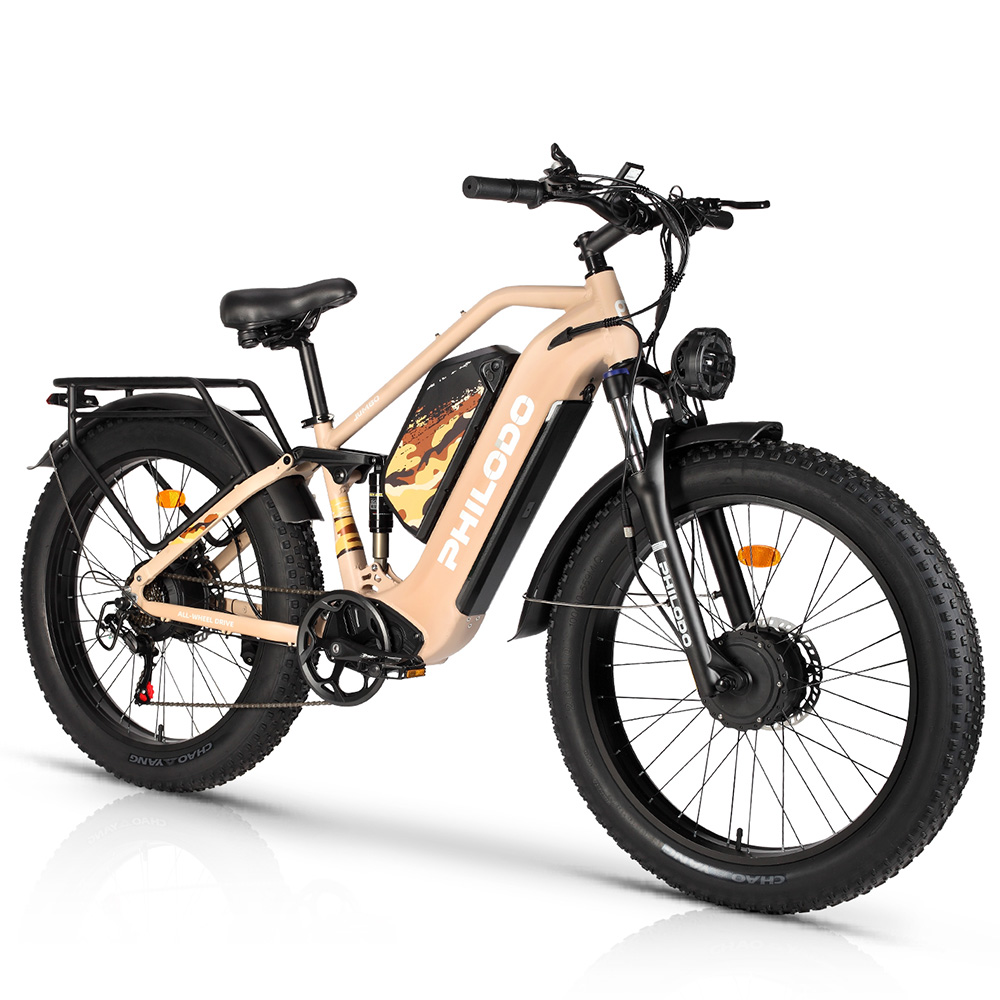 Una bici elettrica con ruote grasse color cuoio, parafanghi, sella e pneumatici neri. Ha un portapacchi.