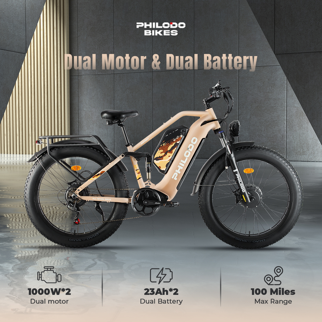 Una fat bike elettrica color cachi con doppio motore e doppia batteria.