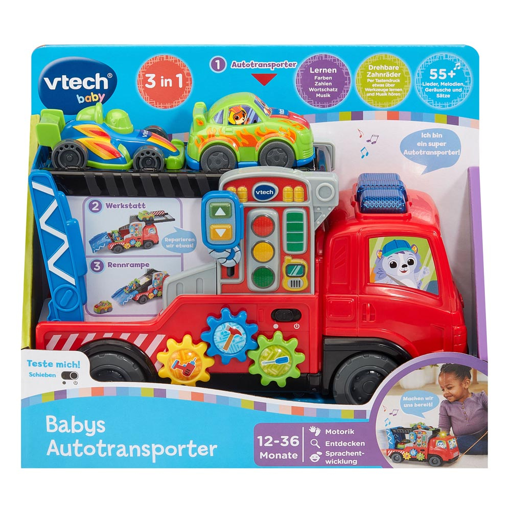 Ein VTech Baby Autotransporter Spielzeug, ein roter LKW mit zwei bunten Autos oben drauf, in seiner Verpackung.