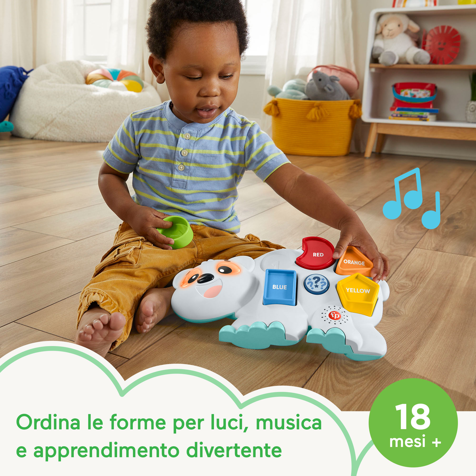 Ein kleiner Junge spielt mit einem bunten Tier-Lernspielzeug auf dem Boden.