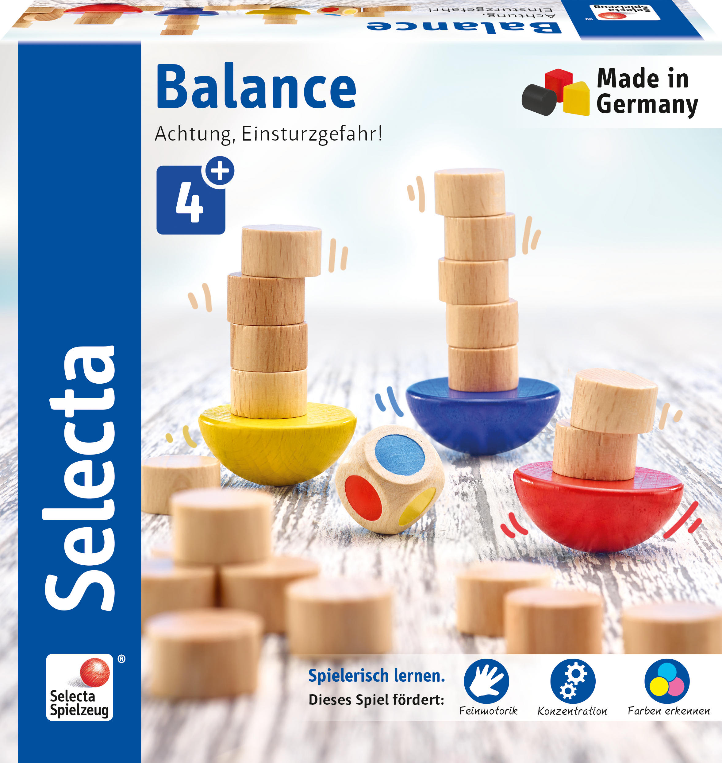 Eine 'Balance'-Spielbox mit gestapelten Holzscheiben auf farbigen Halbkugeln und einem Würfel, fördert Motorik.