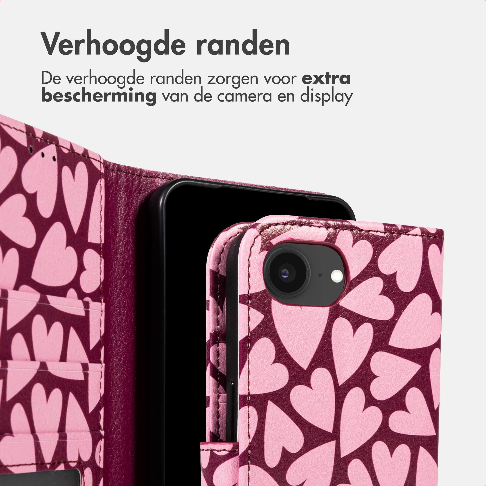 A pink phone case with a heart pattern and camera cutout.