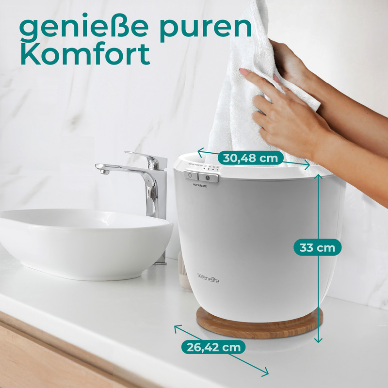 Ein weißer Handtuchwärmer steht neben einem Waschbecken. Maße sind angegeben.