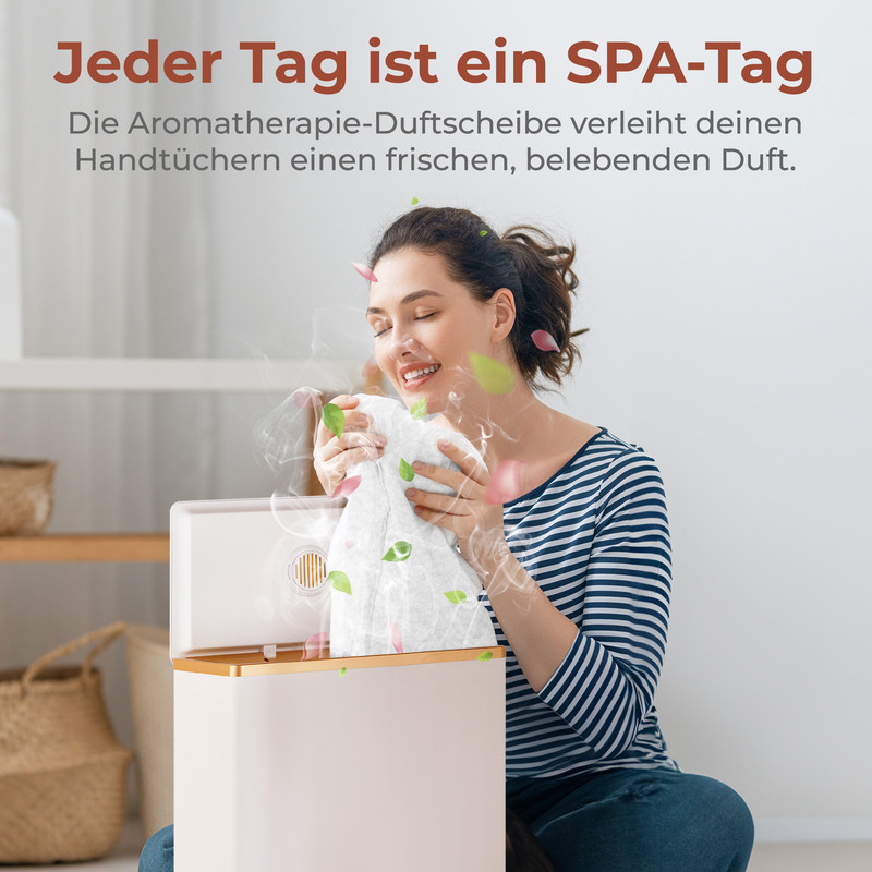 Eine Frau riecht an einem duftenden Handtuch aus einem Diffusor.