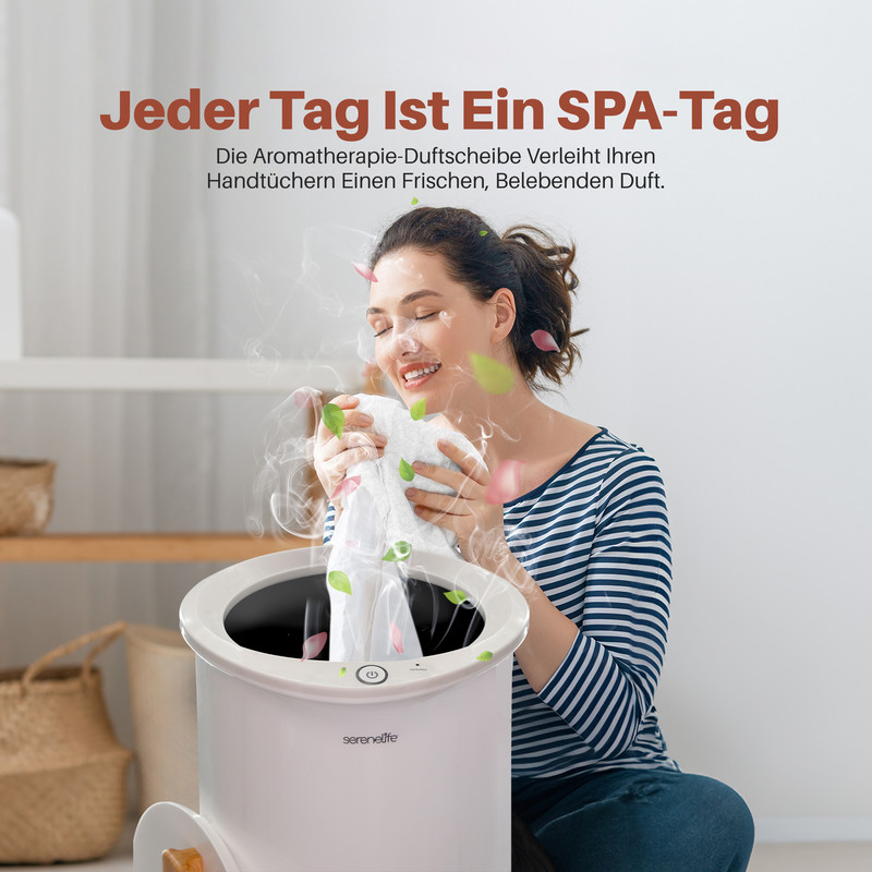 Frau riecht an duftendem Handtuch, das aus einem Gerät kommt.