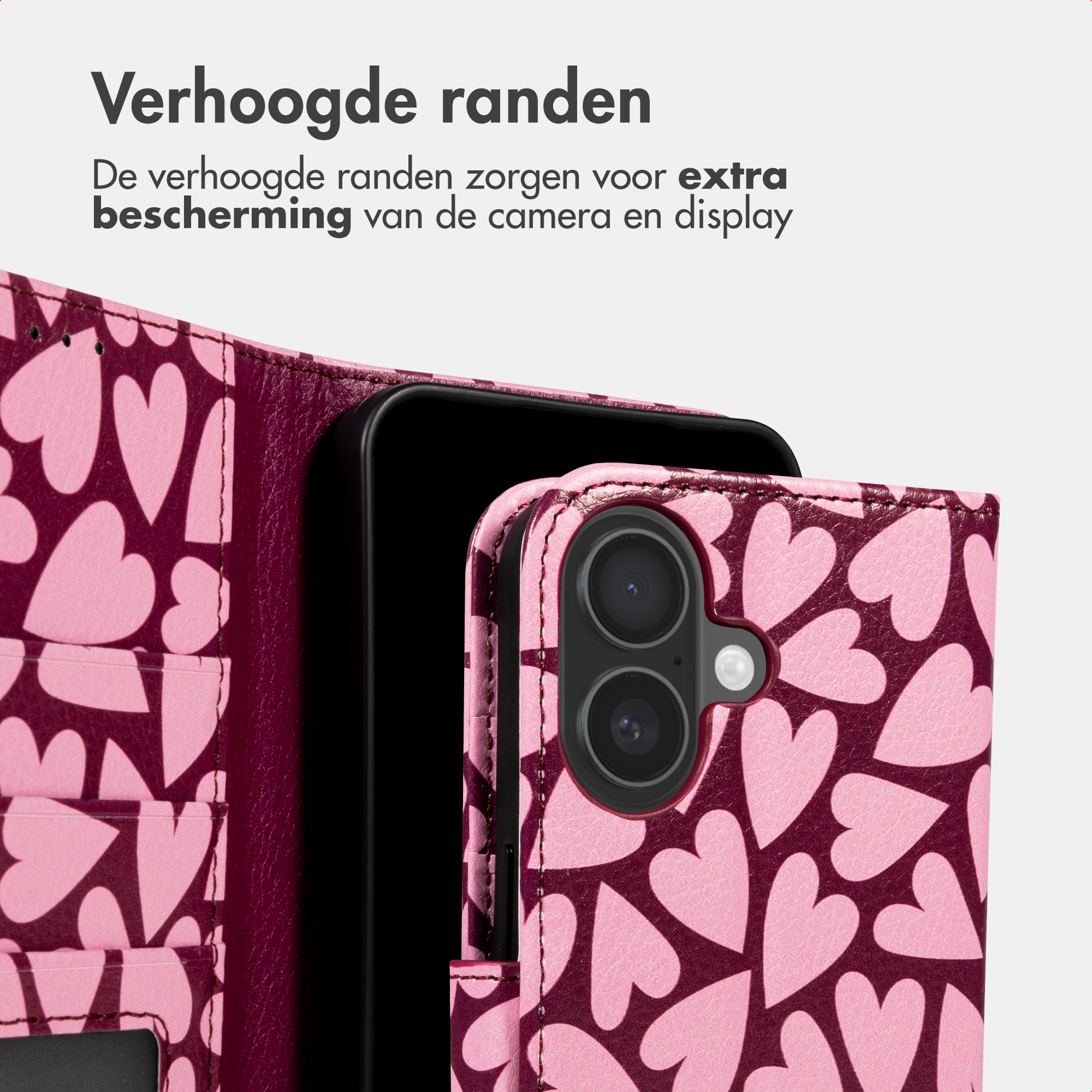 Una custodia per telefono rosa con motivo a cuore e due obiettivi.