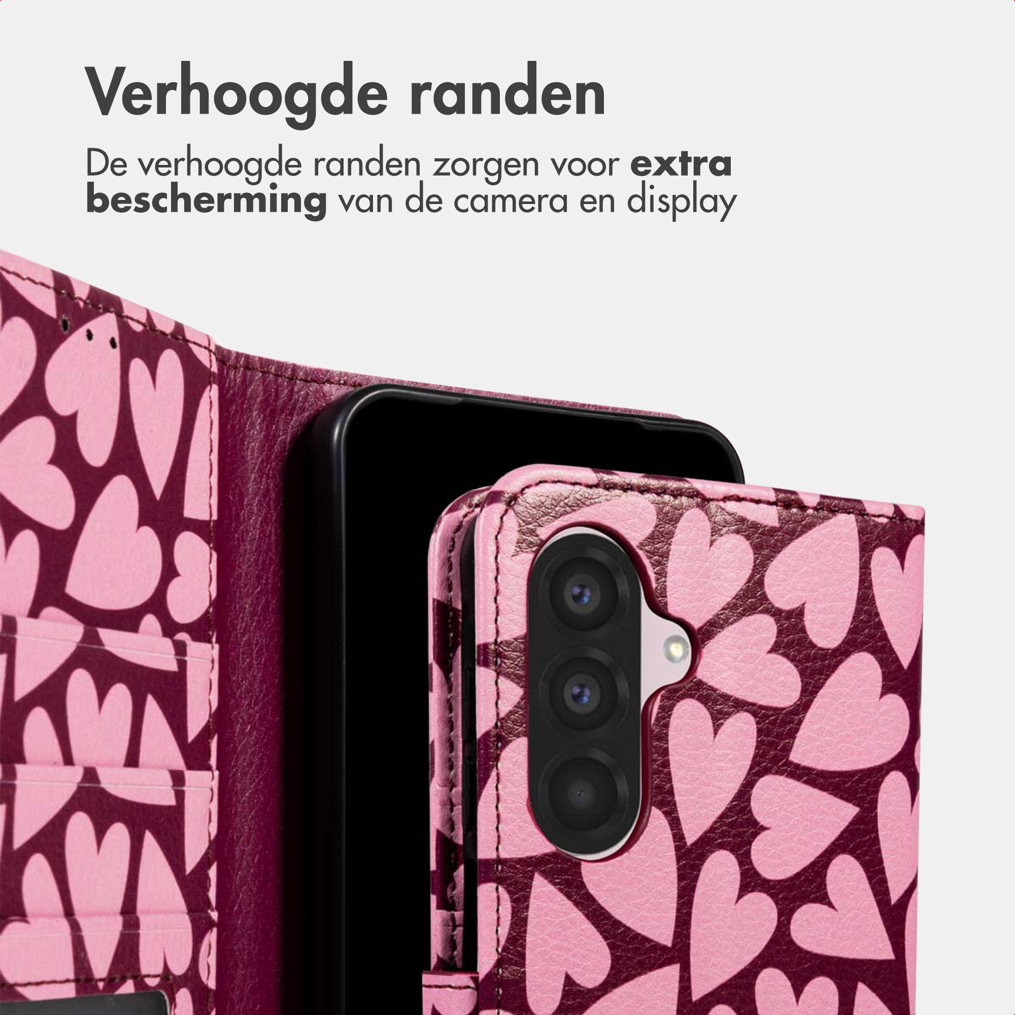 Una custodia per telefono rosa con motivo a cuore protegge una fotocamera.