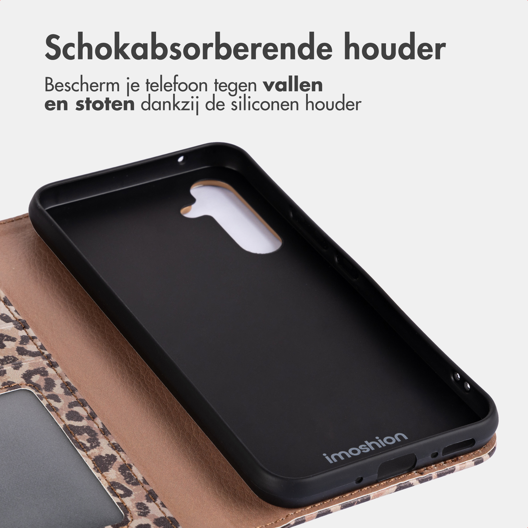 Black phone case with leopard print on brown leather.