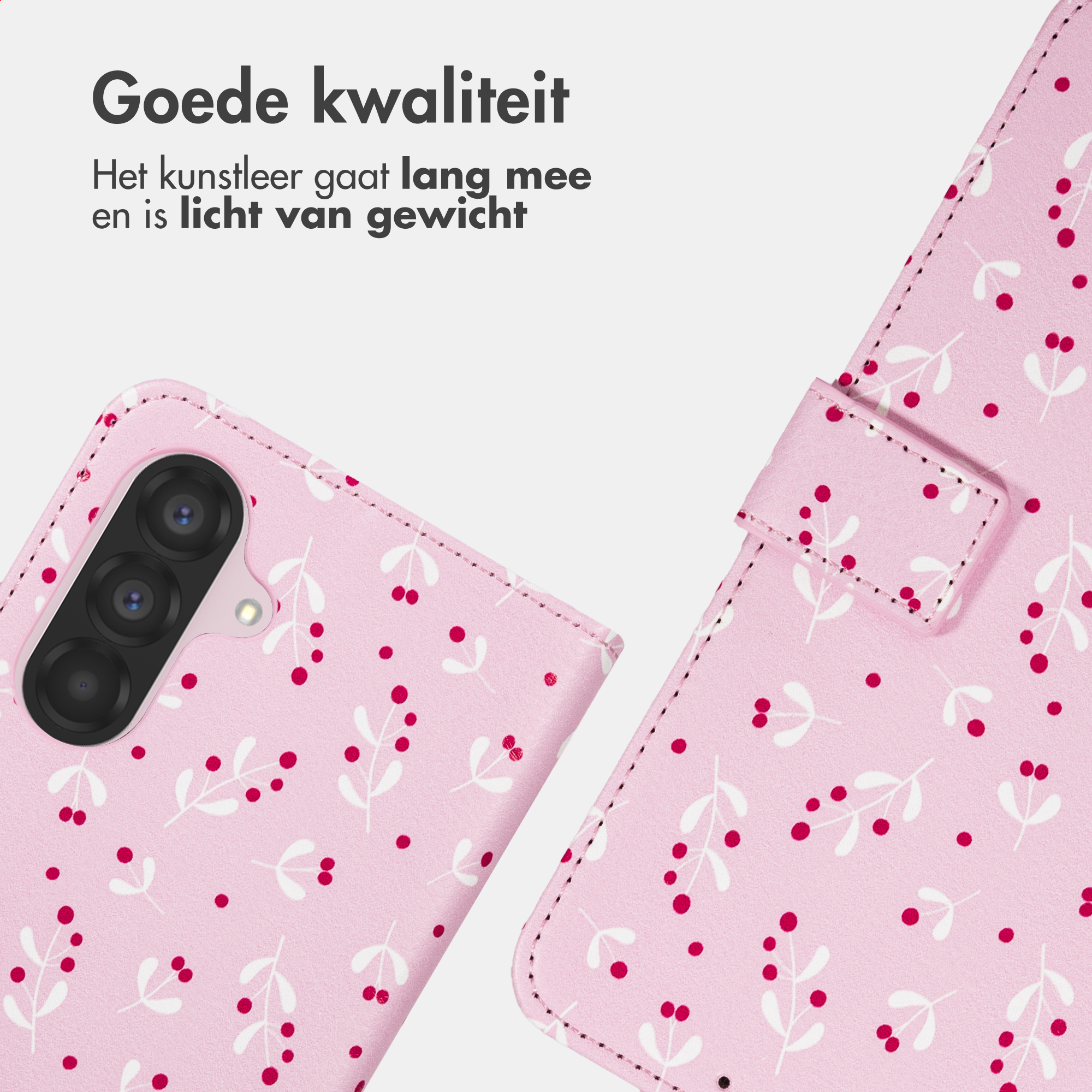 Una custodia per telefono rosa con un motivo di foglie bianche e bacche rosse.