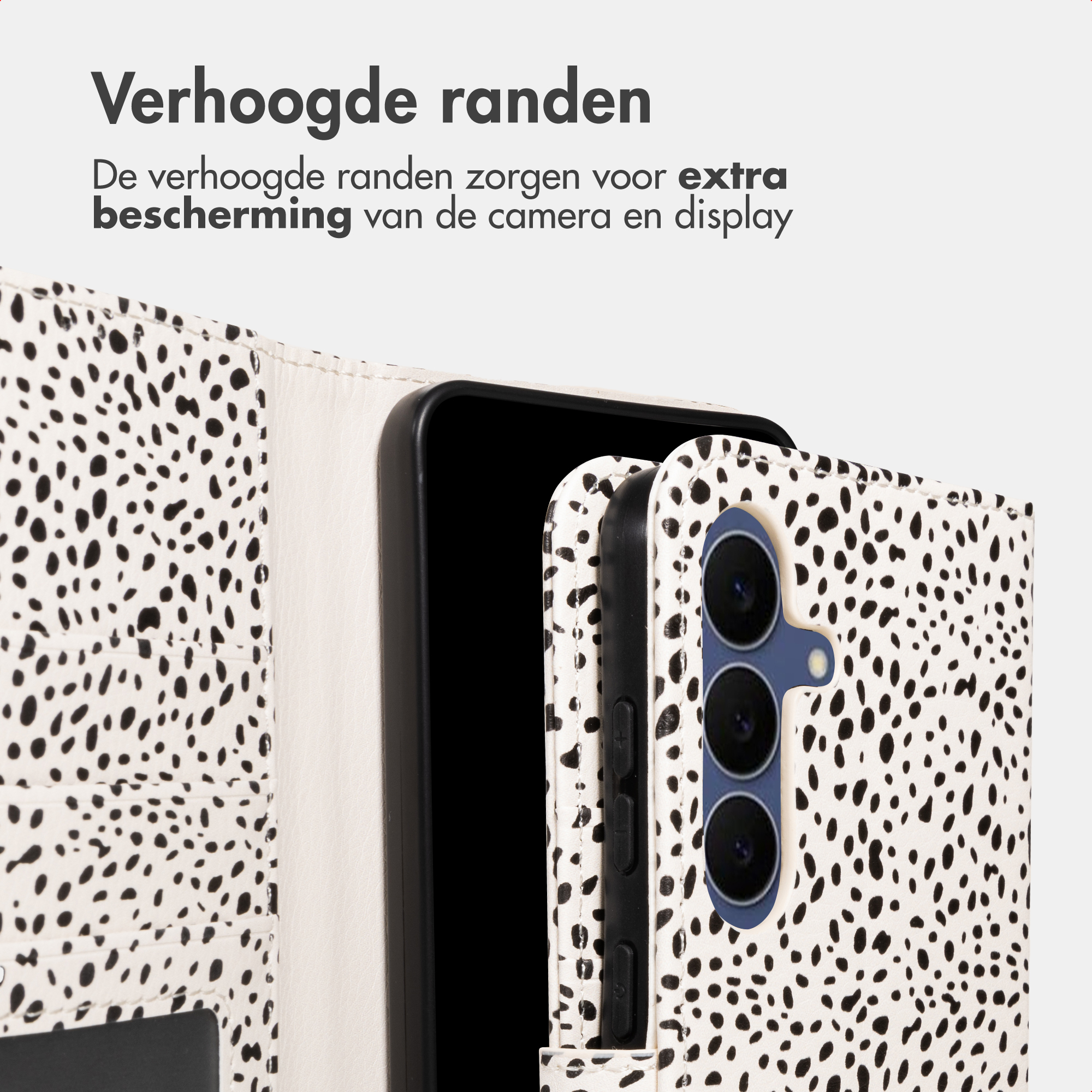 A phone with a black and white spotted pattern cover. The camera is visible.