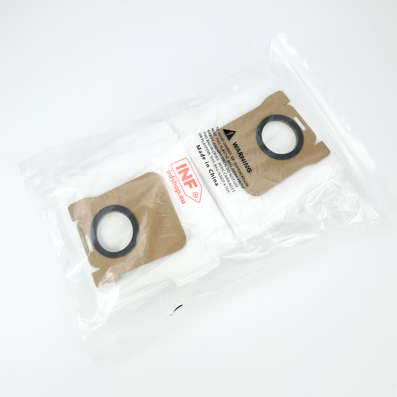 Two vacuum cleaner bags in a plastic bag with a warning label.
