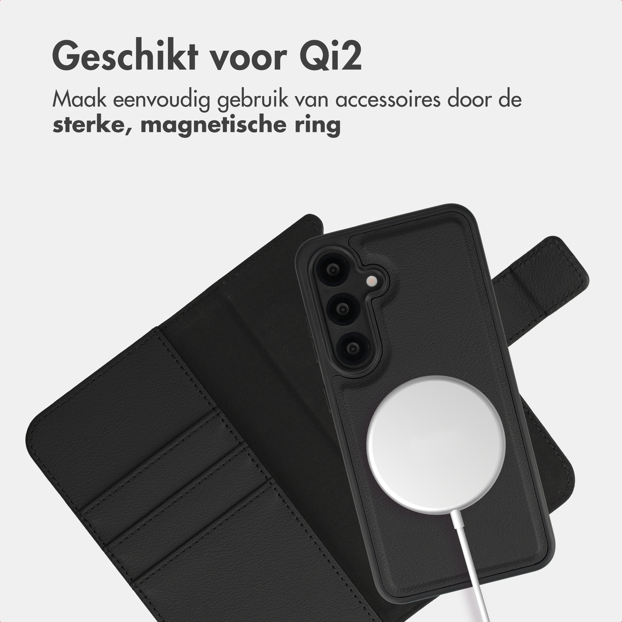 Schwarzes Handycover mit Magnetring und Ladekabel, auf grauem Hintergrund.