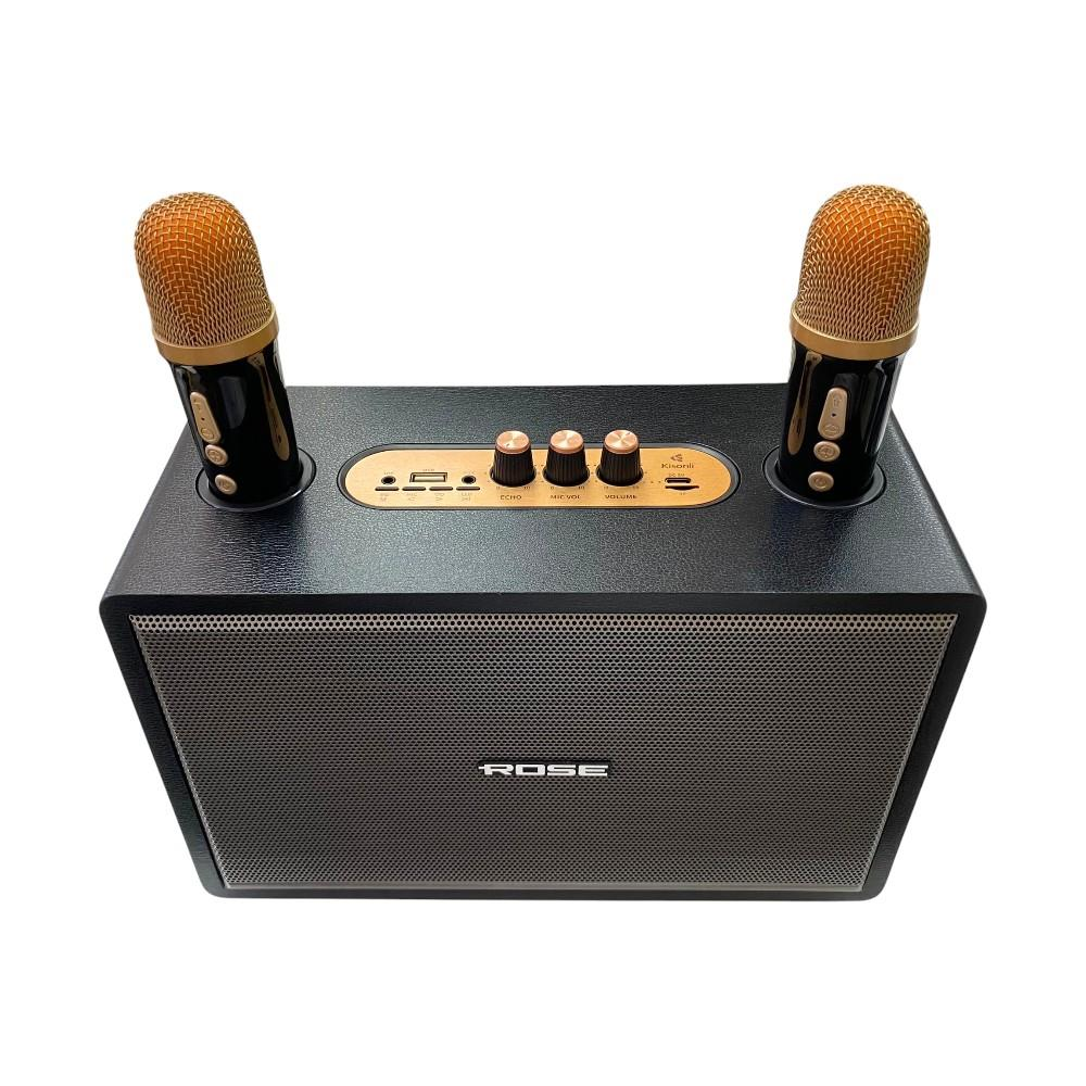 Üstünde kontrol düğmeleri ve iki altın mikrofon bulunan siyah bir Bluetooth hoparlör.