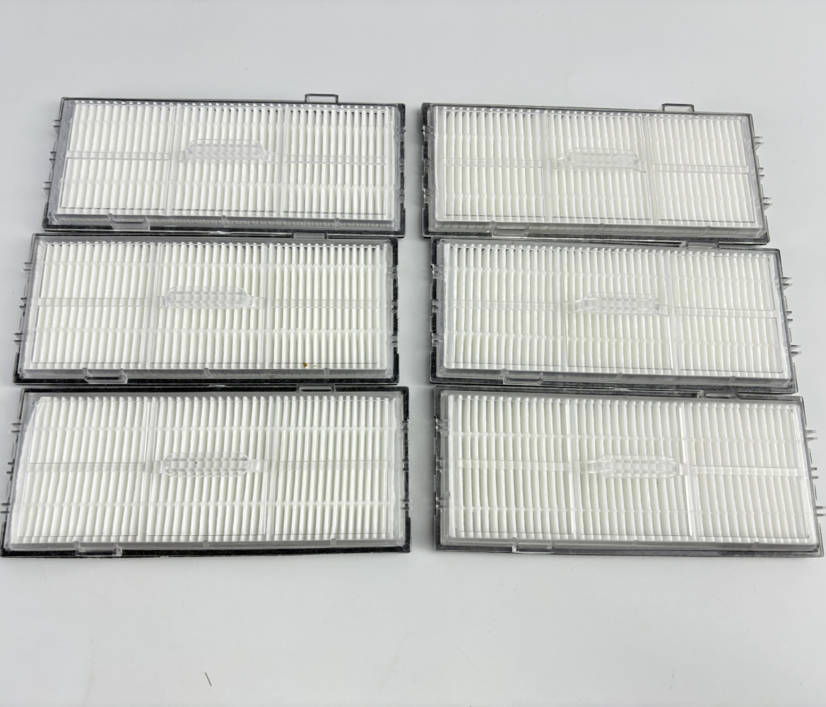 Zes witte stofzuigerfilters met doorzichtige frames, naast elkaar op witte achtergrond.
