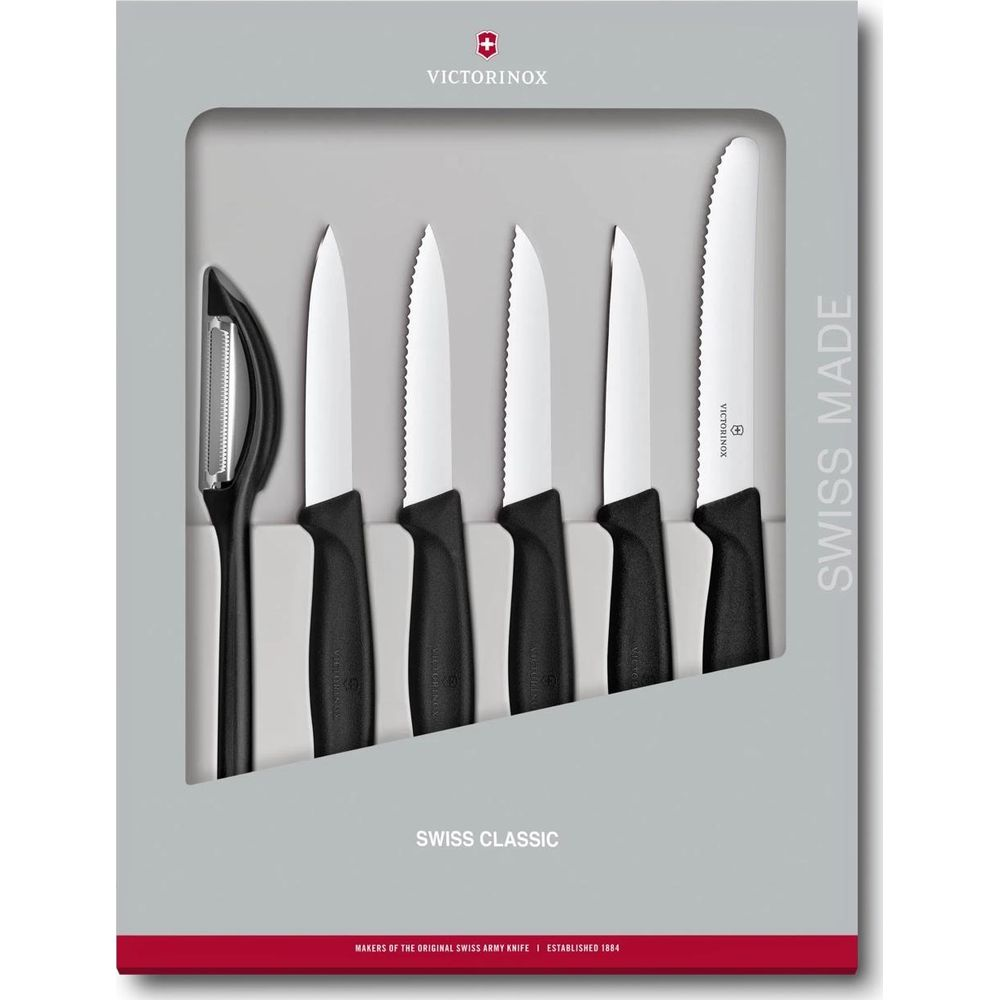 Gri bir kutuda beş adet Victorinox Swiss Classic bıçak ve bir soyacak seti.