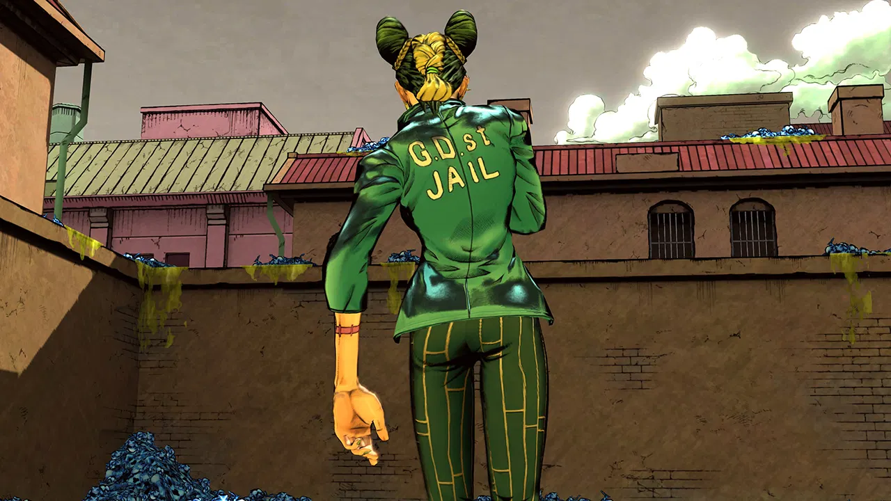 Sırtında "G.D. St. JAIL" yazan yeşil ceketli bir karakter, tuğla duvarlı bir sokakta duruyor.