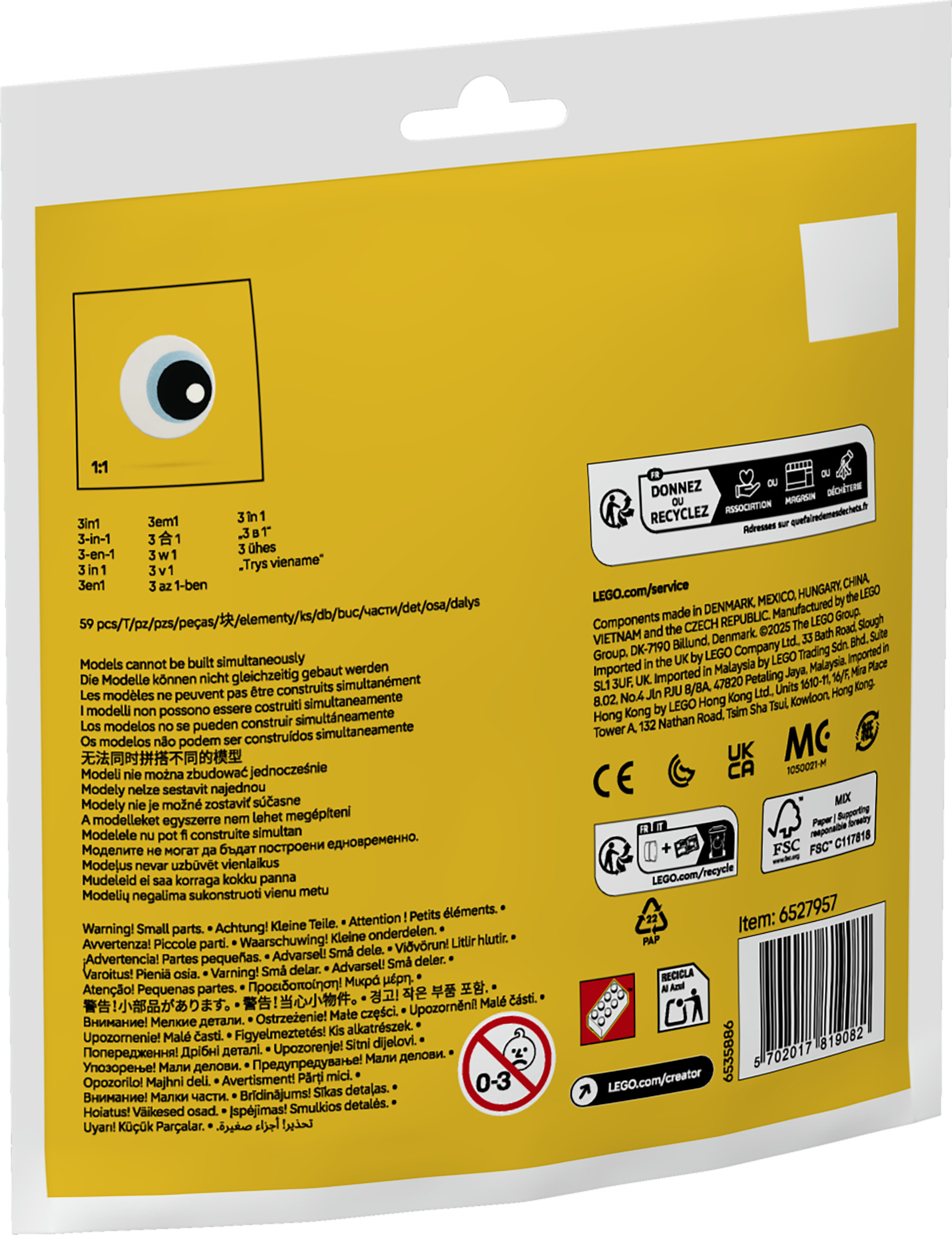 Embalaje con advertencias y logo de LEGO, muestra un solo ojo.