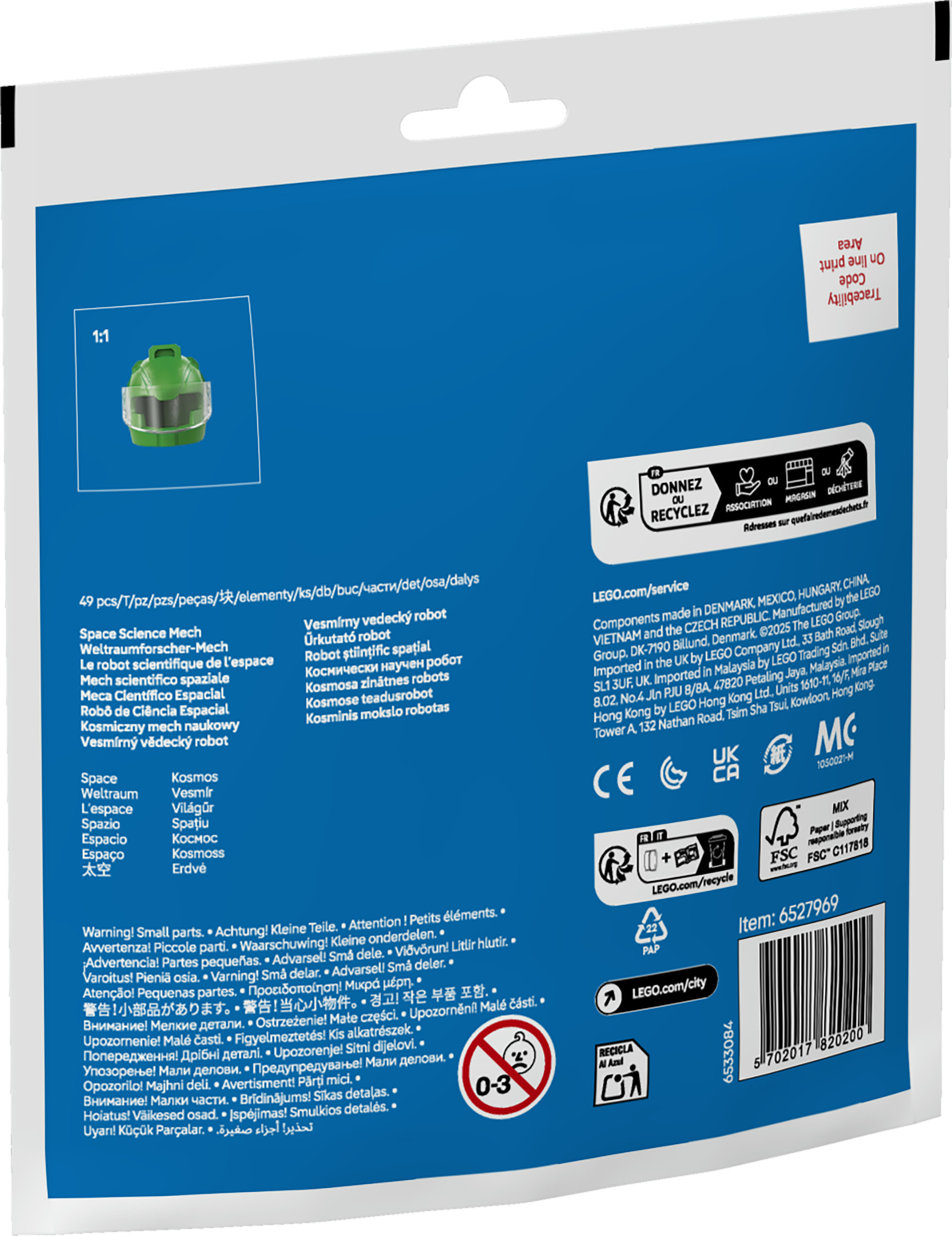 Un casque Lego vert avec une visière transparente est présenté sur un fond bleu, faisant partie d'un emballage de produit avec du texte.