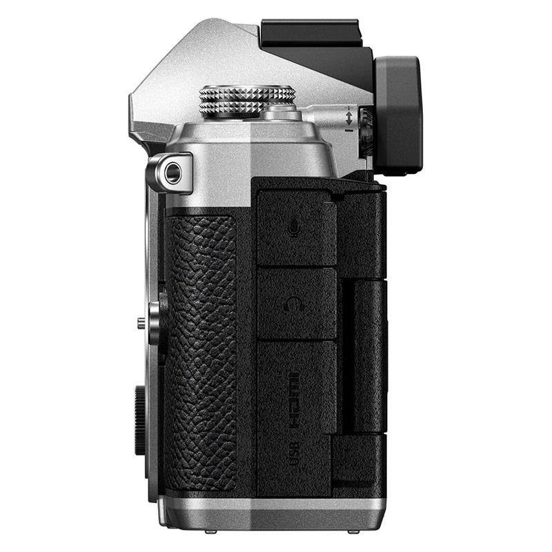 Side view of a silver camera with black controls and ports. USB and HDMI ports visible.