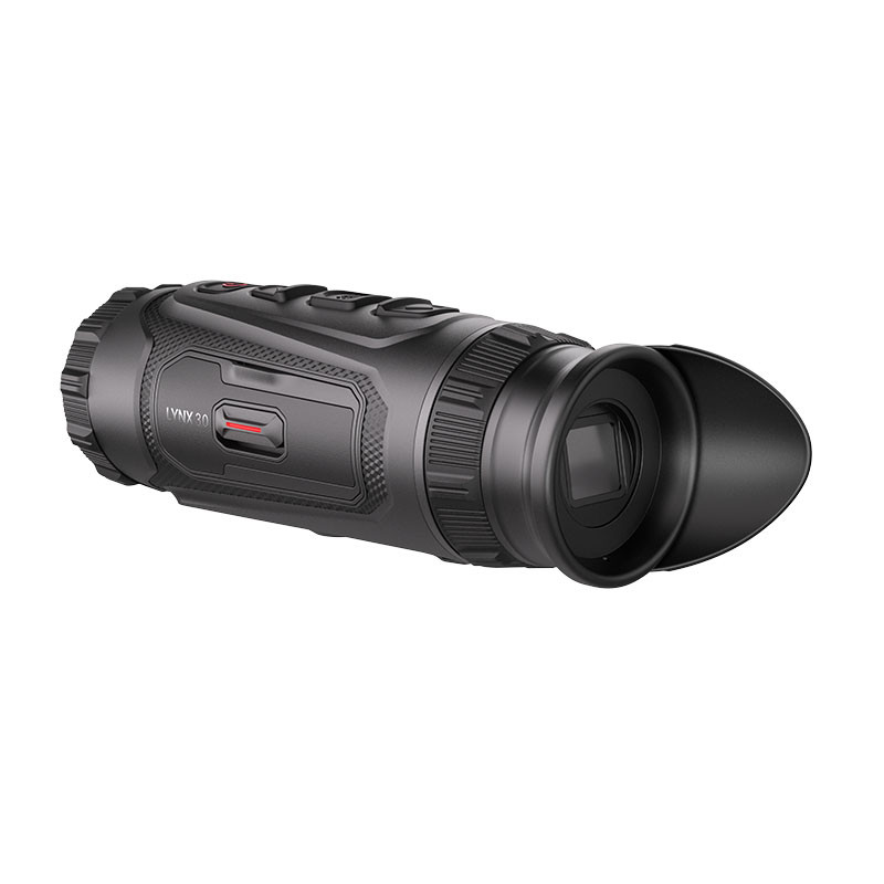 A black portable monocular night vision device with buttons.
