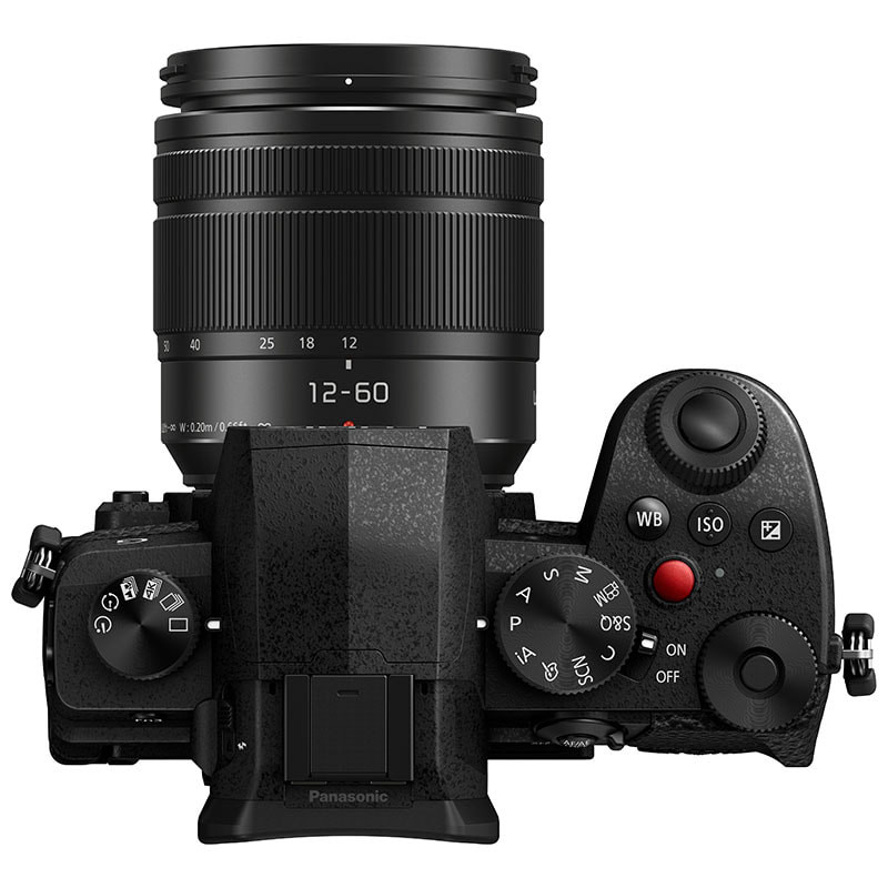 A black Panasonic digital camera with a 12-60mm lens, viewed from above.