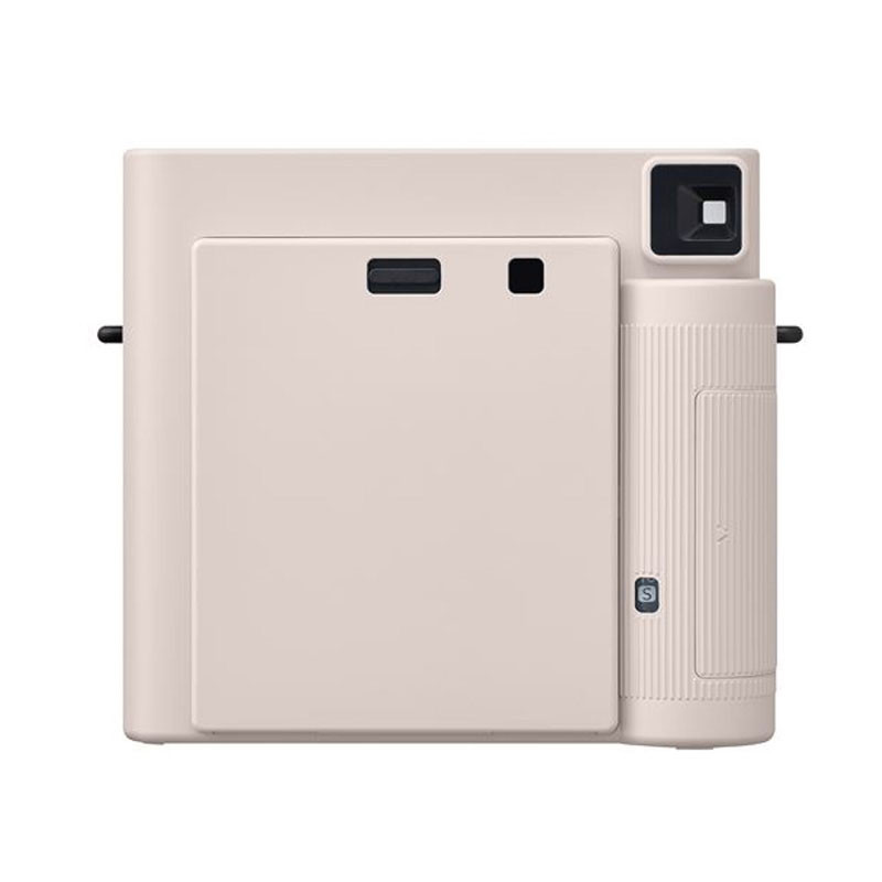 A light pink instant camera with lens and viewfinder.