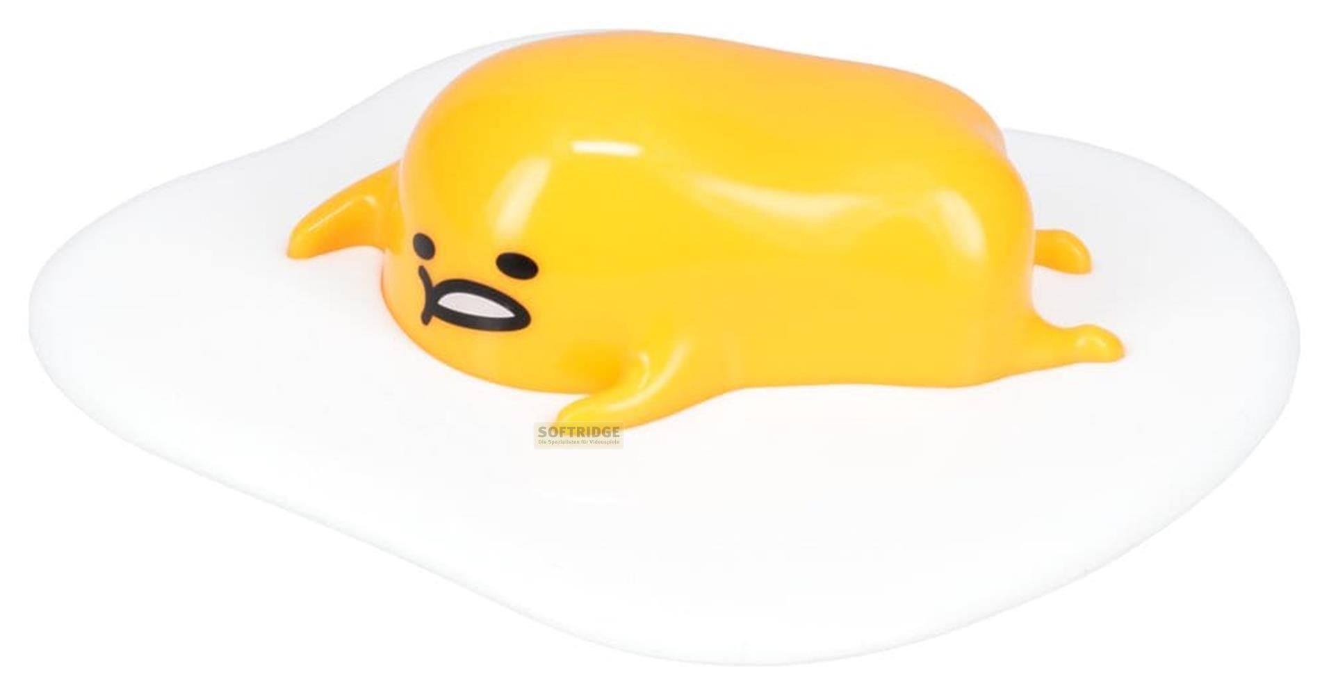 Eine gelbe Figur mit traurigem Gesicht liegt auf einem weißen Eiweiß.