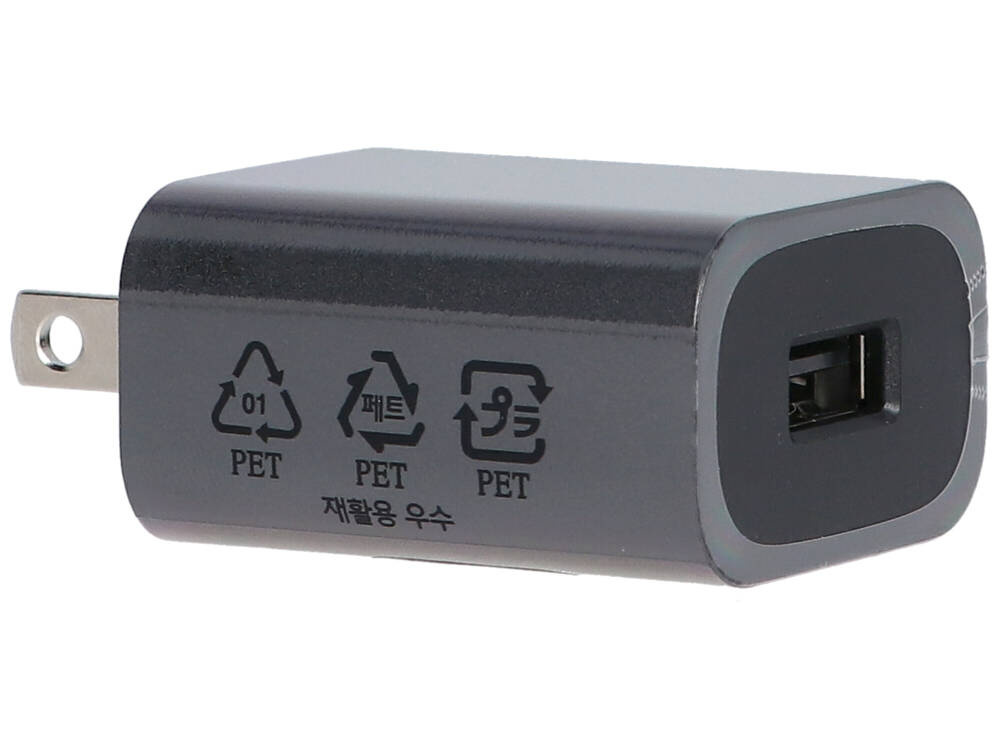 Ciemnoszary adapter zasilający USB z jednym portem USB i wtyczką.