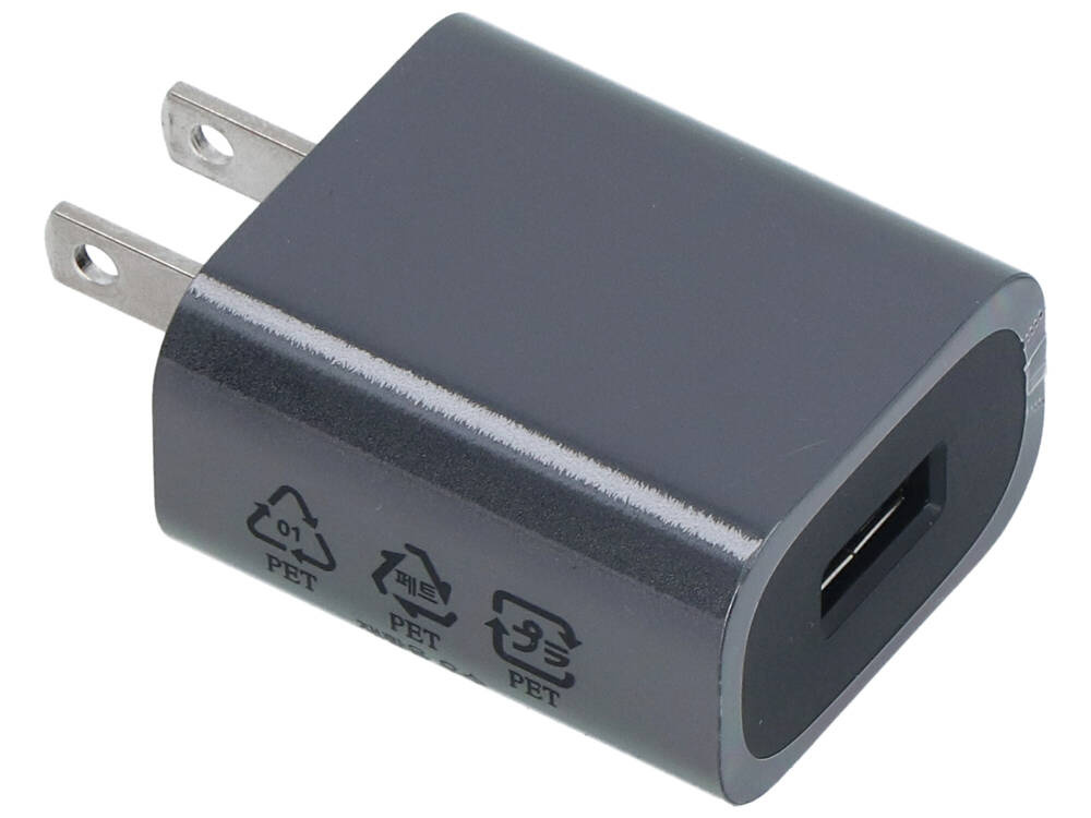 Szary adapter USB z dwoma płaskimi bolcami i portem USB.