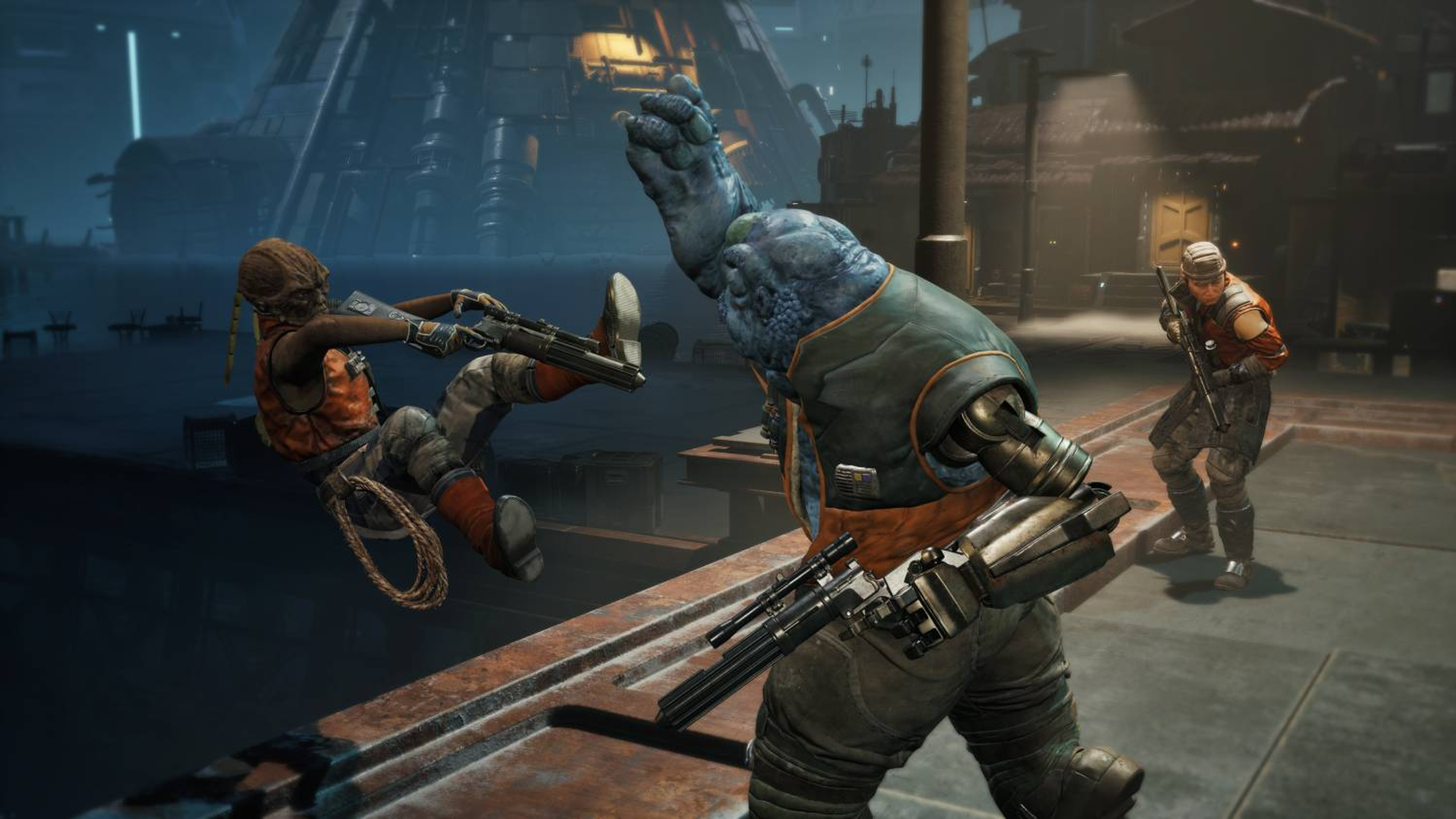 Un guerriero alieno blu combatte un guerriero umano davanti a una grande fabbrica.
