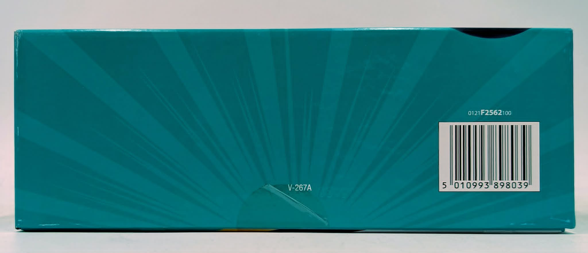 Türkisfarbene Verpackung mit Strahlendesign und Barcode.