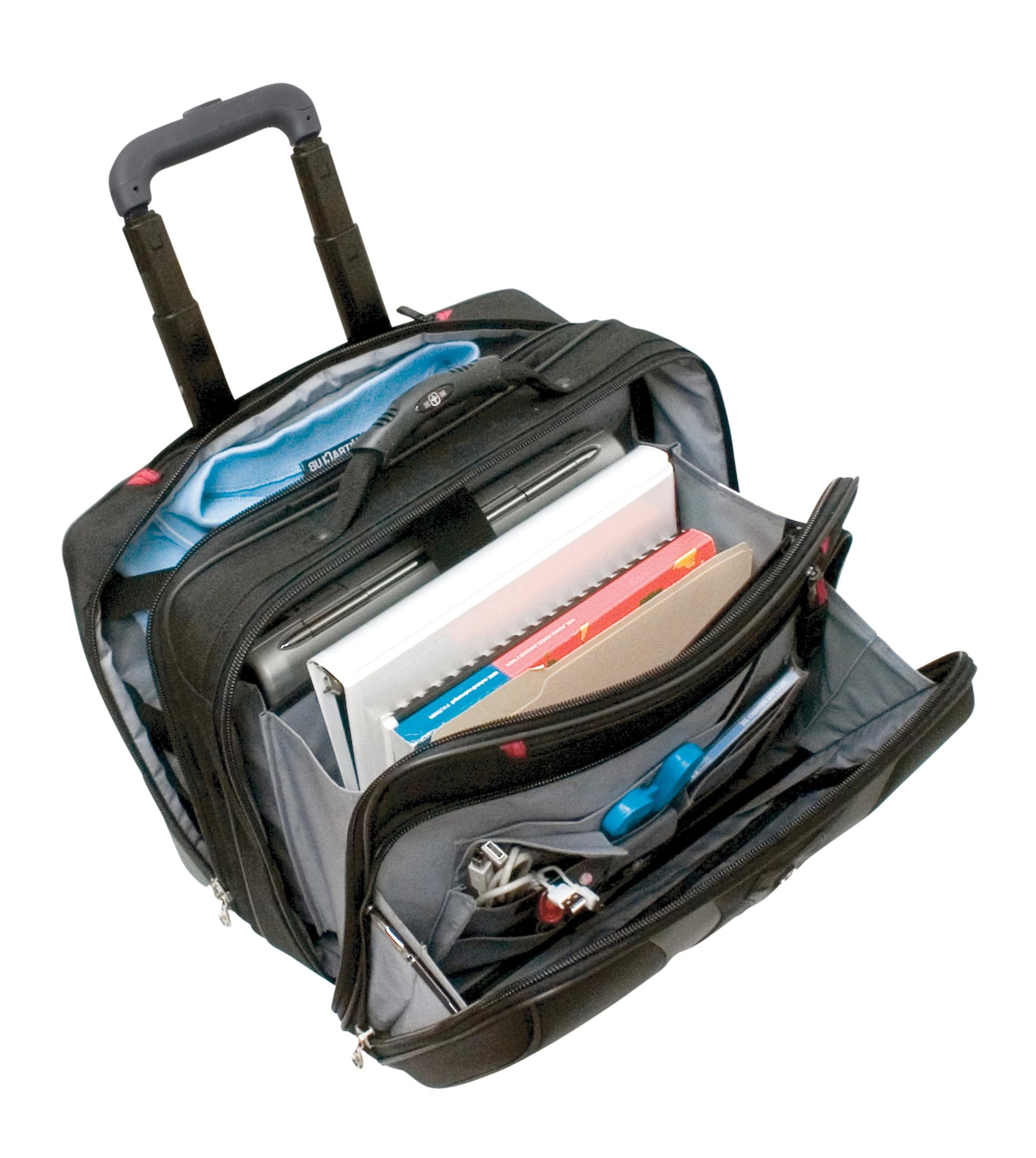 Eine offene schwarze Laptoptasche auf Rädern mit Büchern, Stiften und Kabeln darin.