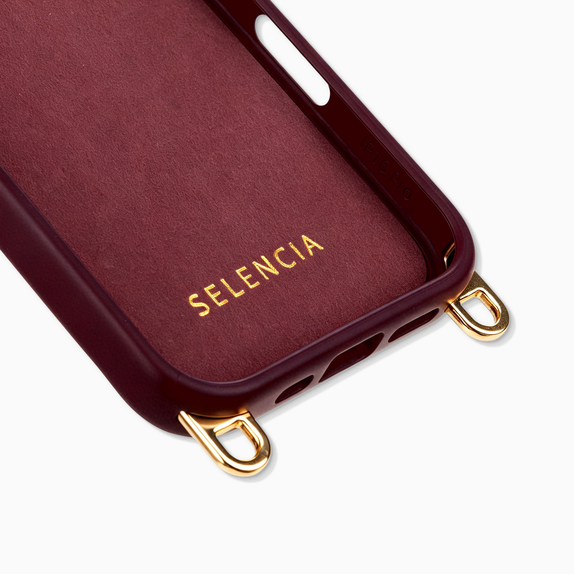 Funda burdeos con ojales dorados, interior con texto "SELENCIA".