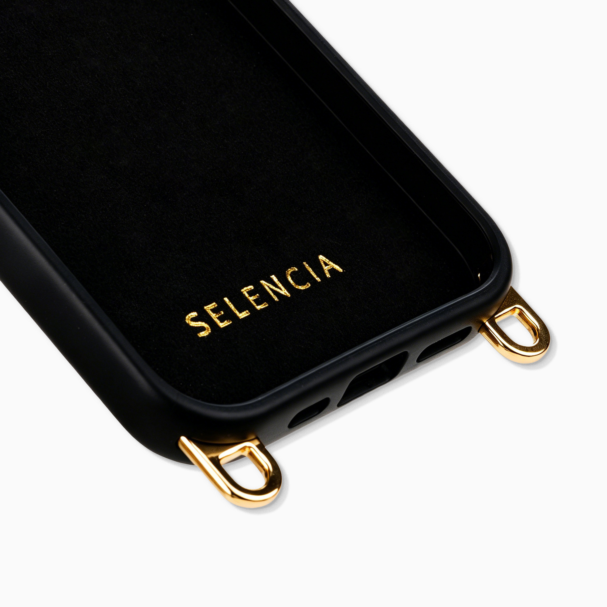 Black phone case with gold eyelets and the text SELENCIA.