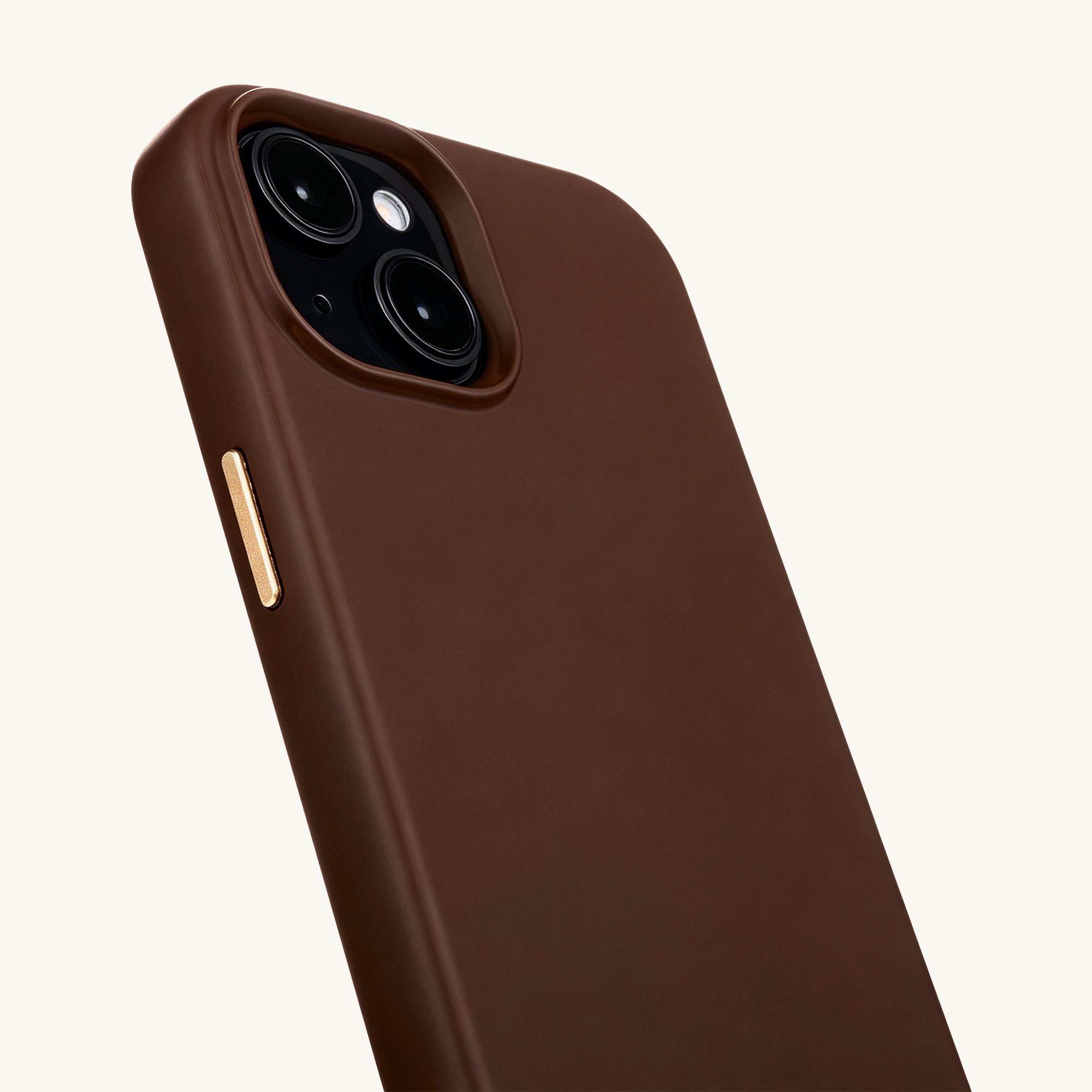 Brown phone case with two camera lenses and a gold button.