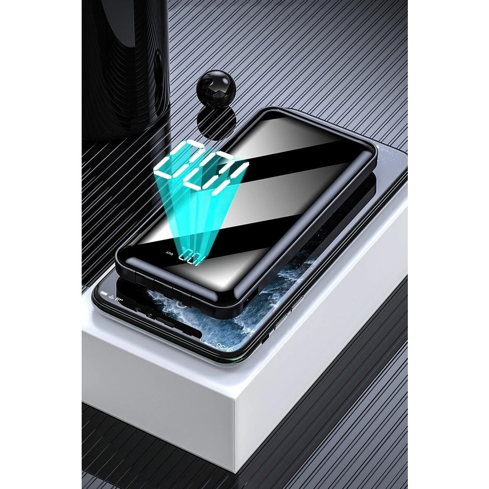 100% göstergeli siyah bir powerbank akıllı telefonun üzerinde duruyor.