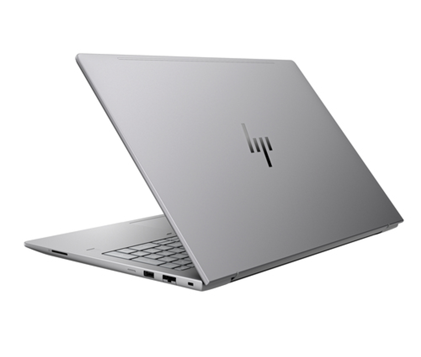 Un portátil HP plateado, cerrado, mostrando teclado y puertos.