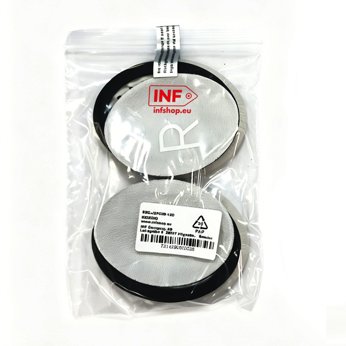 A pair of round headphone ear pads with black edges, in a plastic bag.
