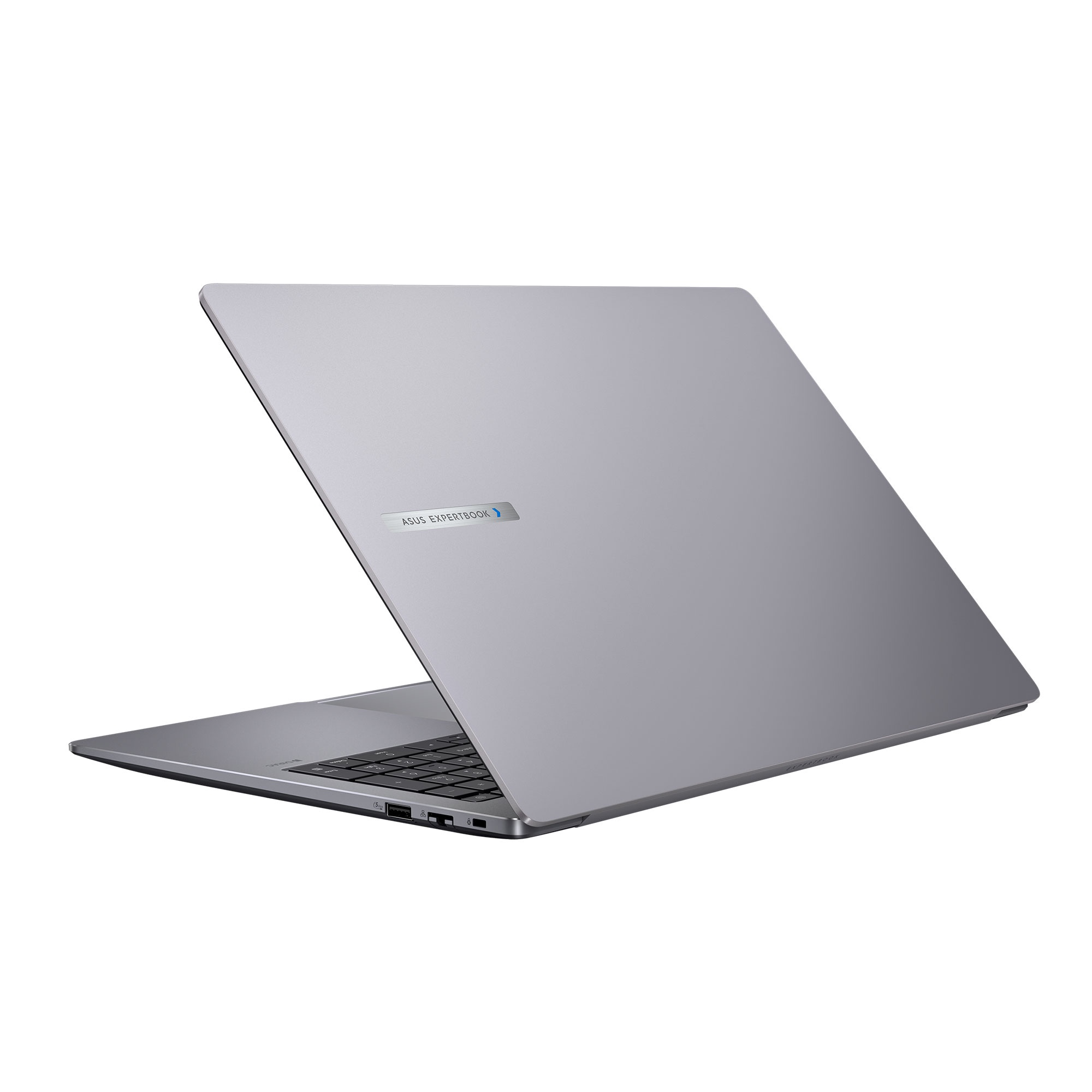 Un portátil Asus Expertbook plateado y cerrado sobre fondo blanco.