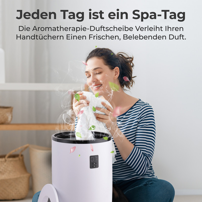 Eine Frau riecht an einem frischen Handtuch, das aus einem weißen Gerät kommt.