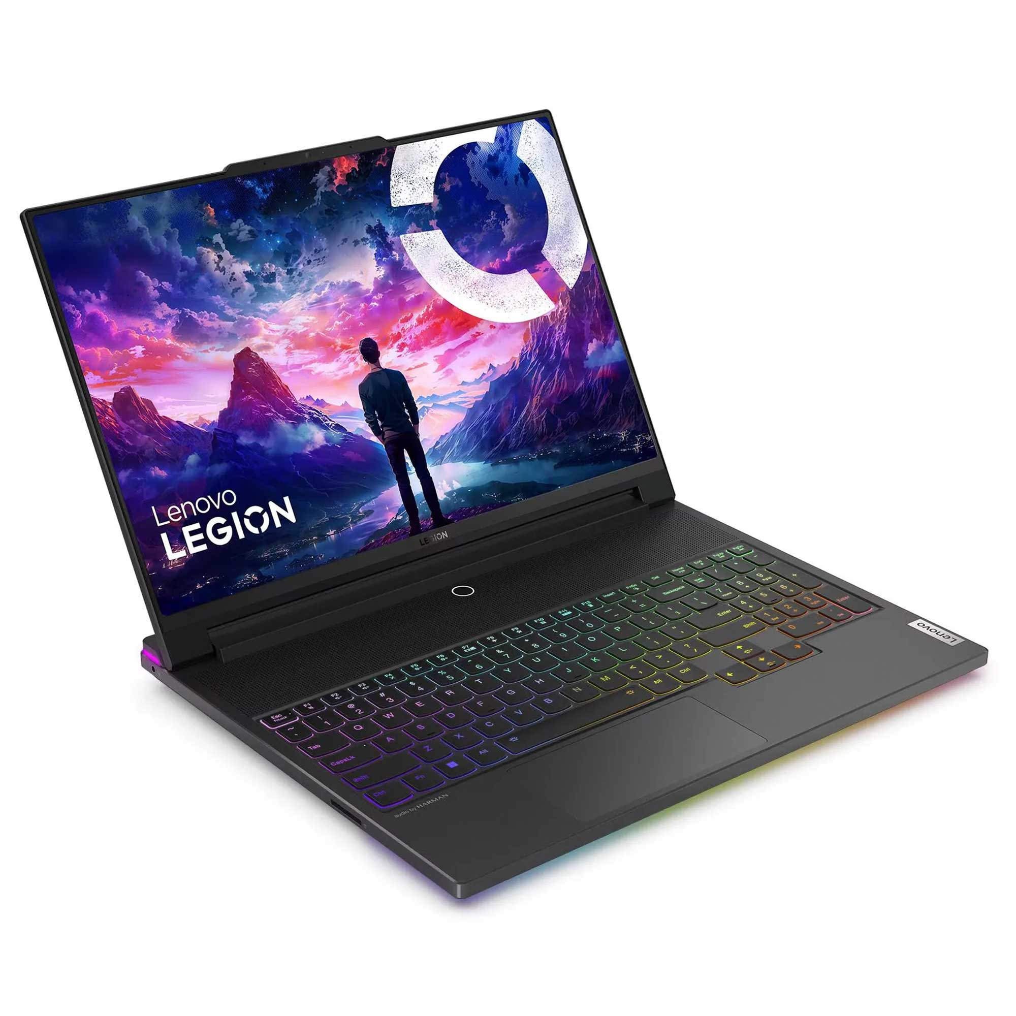 Renkli arkadan aydınlatmalı klavyeli açık Lenovo Legion dizüstü bilgisayar, ekranda dağ manzarası.
